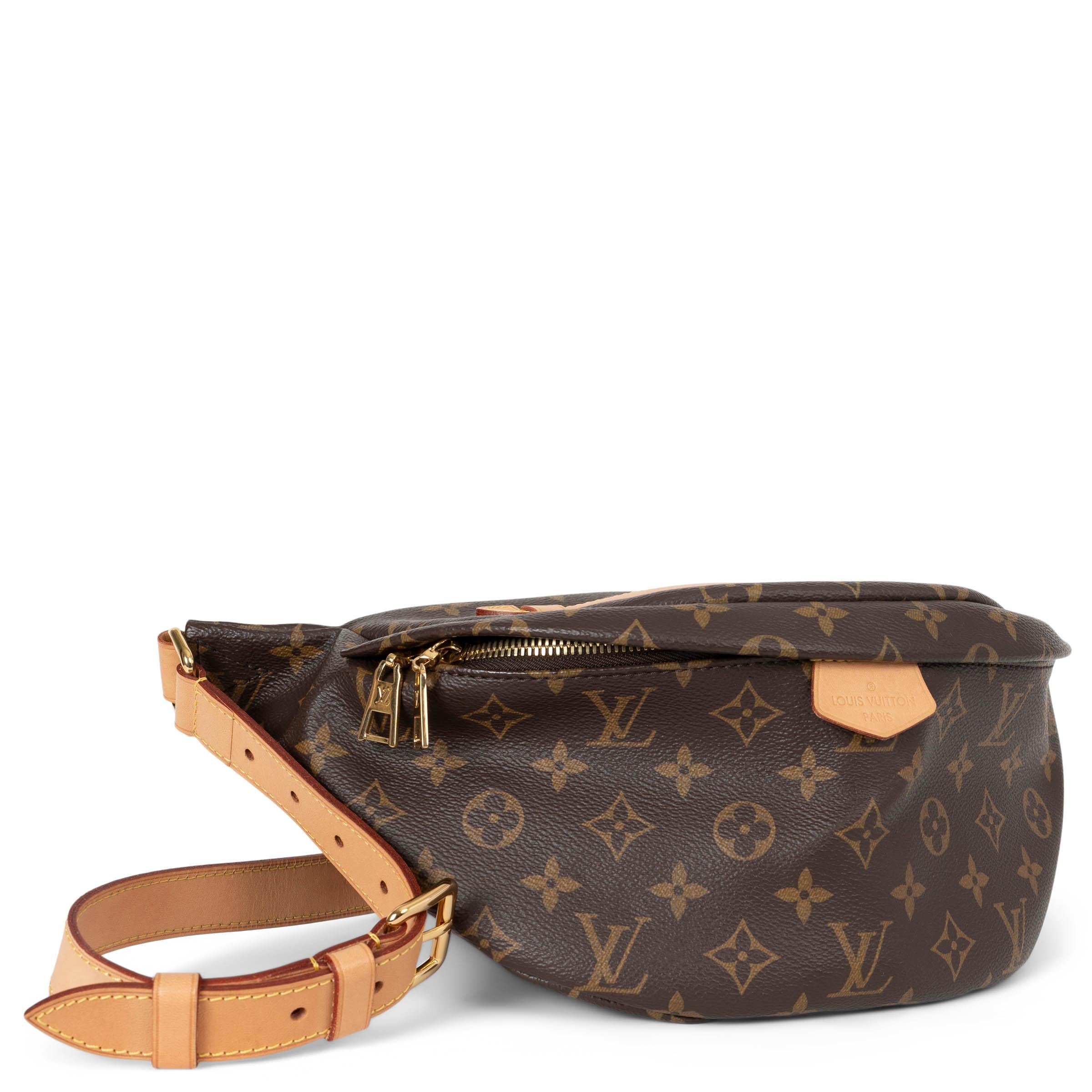 This 100% authentic Louis Vuitton Ebene Monogram Coated Canvas Bumbag with gold hardware is a stylish and versatile accessory. Crafted in the iconic Ebene Monogram coated canvas, it offers a timeless look with durable construction. The bumbag is