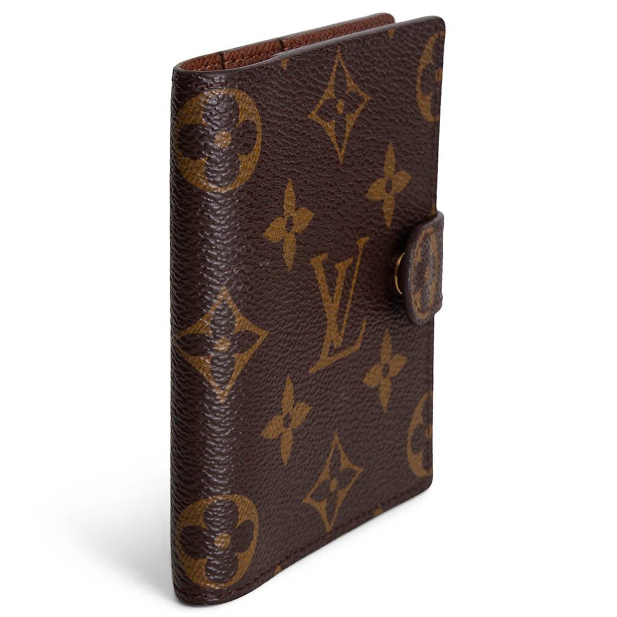 100% authentic Louis Vuitton Monogram Canvas card wallet. Opens with a snap button and is lined in brown coated canvas with 3 slip pockets. Has been carried and is in excellent condition. 

Measurements
Width	9cm (3.5in)
Height	10.5cm