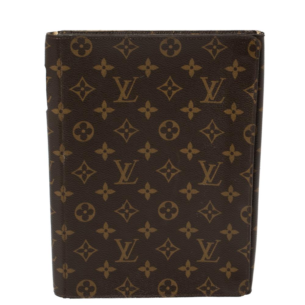 This creation by Louis Vuitton has been crafted in a foldable style using the brand's signature monogram-coated canvas and leather to protect your iPad. The case is complete with gold-tone press studs within the interior.

Includes:  Receipt