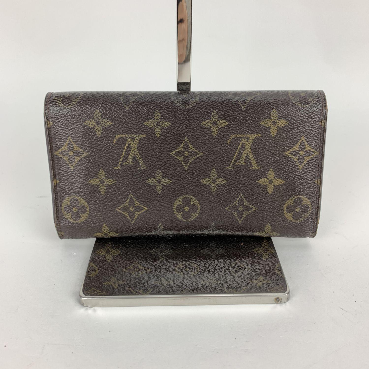Louis Vuitton Monogram Canvas International Wallet. Monogram canvas exterior and genuine leather interior. 6 credit card slots. 2 long compartments for bills and papers. Snap closure. Pen holder. Interior coin pocket also with snap closure. Golden