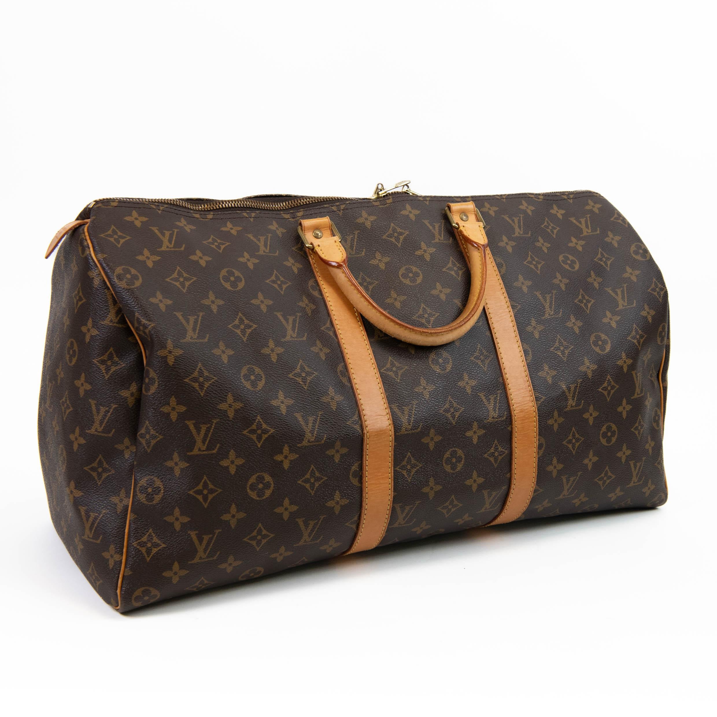 100% Authentic

This stylish duffel is crafted of signature Louis Vuitton monogram on toile canvas. This shoulder bag features vachetta cowhide leather trim including rolled top handles, a detachable adjustable shoulder strap and straps around the