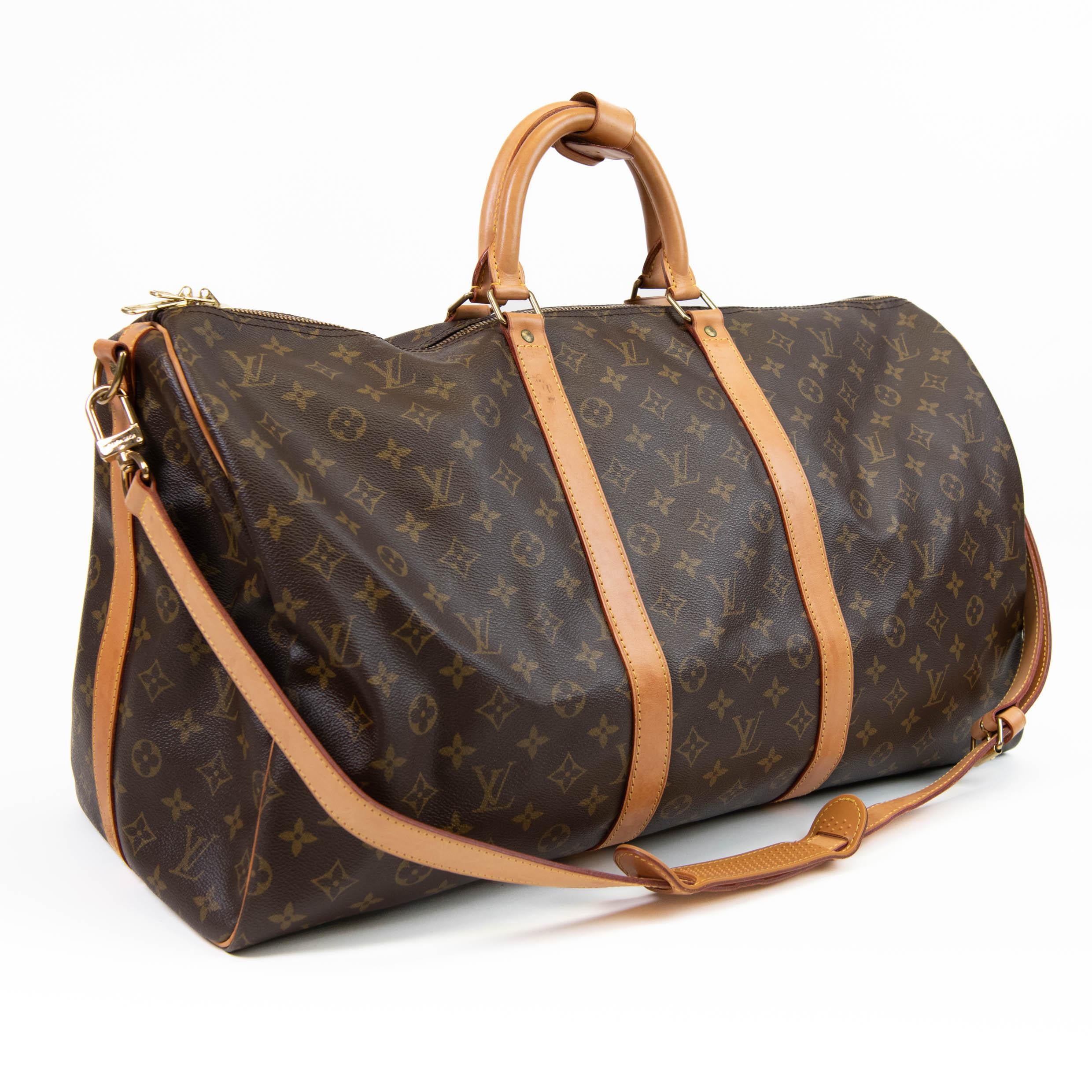 100% Authentic

This stylish duffel is crafted of signature Louis Vuitton monogram toile canvas. This bag features vachetta cowhide leather rolled top handles, vachetta leather trim, and a detachable adjustable shoulder strap. The polished brass top