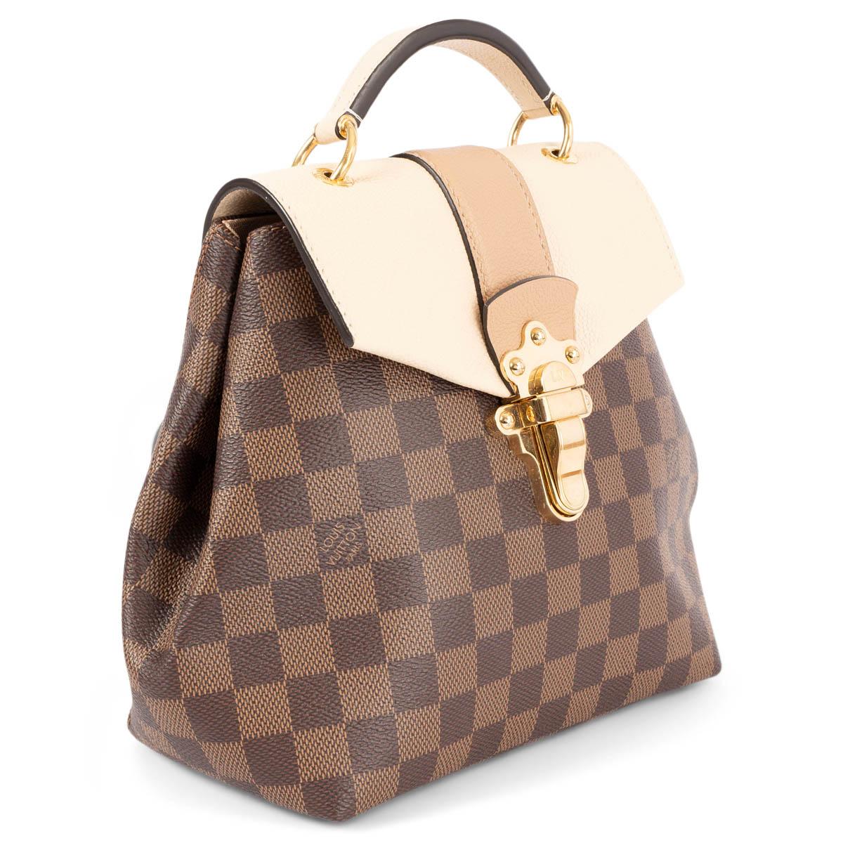 100% authentic Louis Vuitton Clapton backpack in the brand's signature Damier Ebene canvas features a beige and tan grained calfskin leather front flap, a top handle, optional adjustable leather shoulder straps and a polished gold-tone brass LV