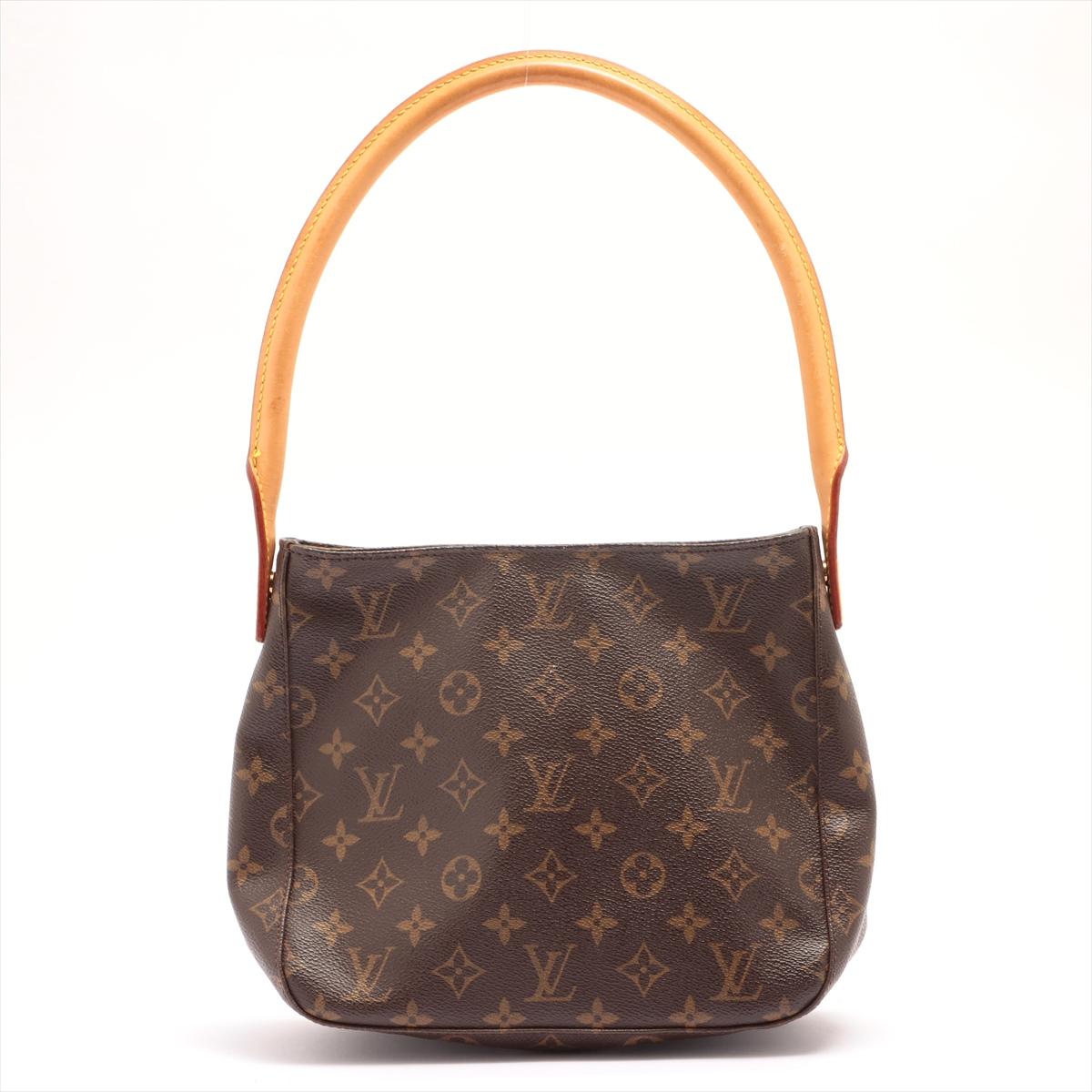 Brown and tan monogram coated canvas Louis Vuitton Looping MM with gold-tone hardware, tan vachetta leather trim, single rolled shoulder strap, creme Alcantara lining, dual pockets at interior wall; one with zip closure and zip closure at top.

