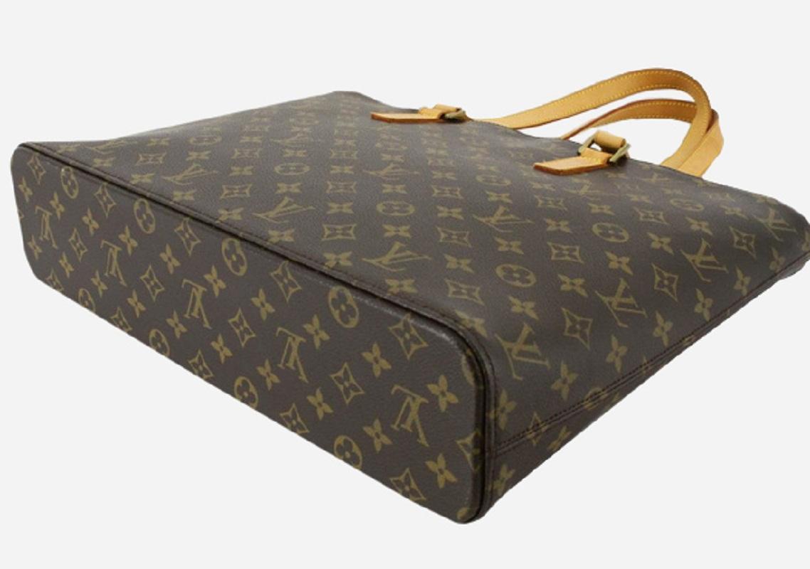 Brown and tan monogram coated canvas Louis Vuitton Luco tote with gold-tone hardware, tan vachetta leather trim, dual flat shoulder straps, beige Alcantara lining, five pockets at interior walls, single zip pocket and zip closure at top.


71979MSC