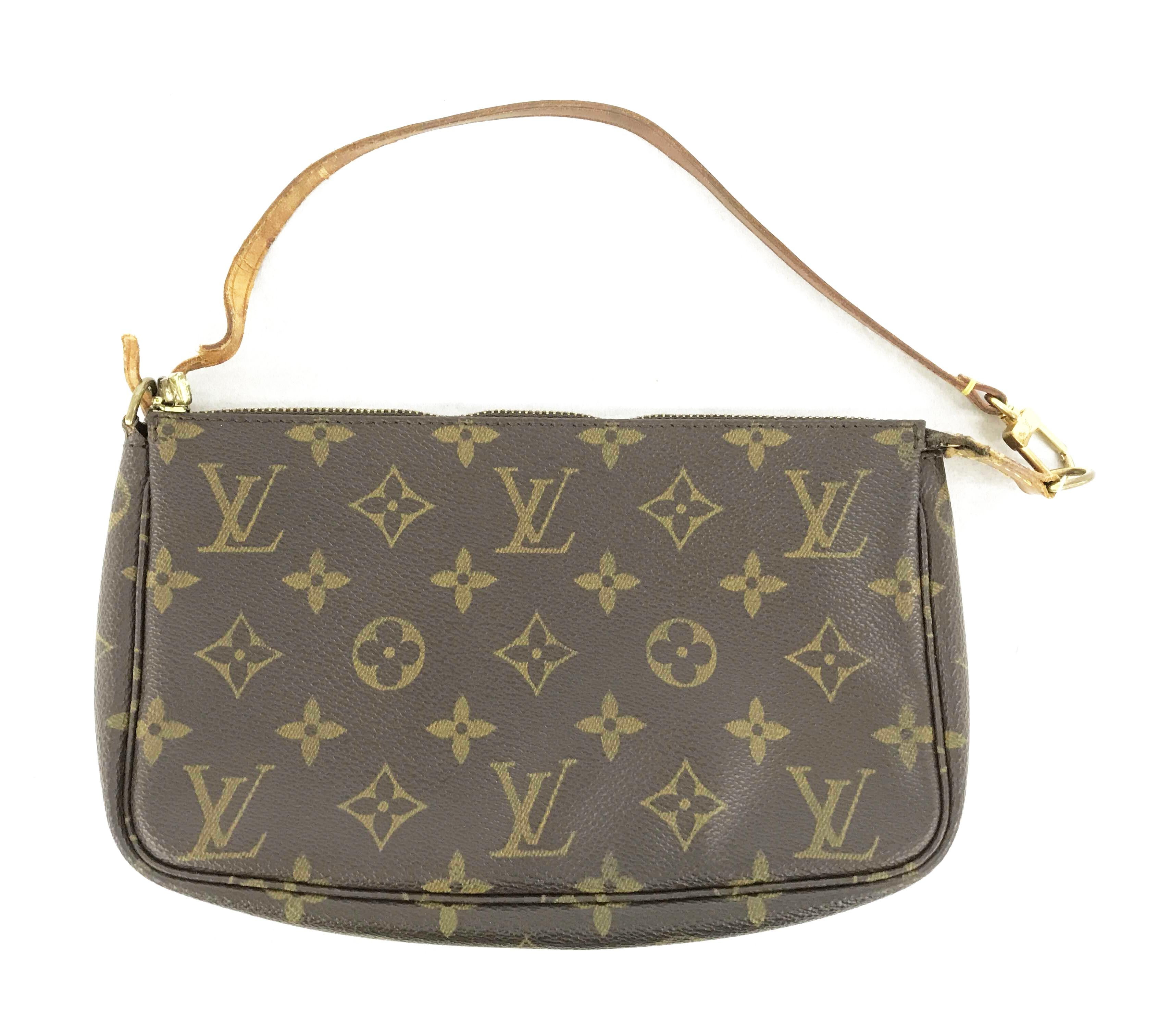 Brown and tan Monogram coated canvas Louis Vuitton Pochette Accessoires shoulder bag with gold-tone hardware, tan Vachetta leather trim, a tan leather shoulder strap, brown canvas lining and zip closure at top.


70361MSC