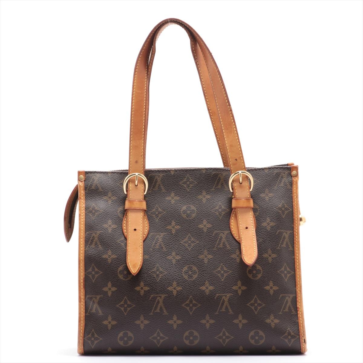Brown and tan monogram coated canvas Louis Vuitton Popincourt Haut Tote Bag with gold-tone hardware, tan vachetta leather trim, dual flat shoulder straps, brown woven lining, dual pockets at interior wall and zip closure at top.

 

67859MSC
