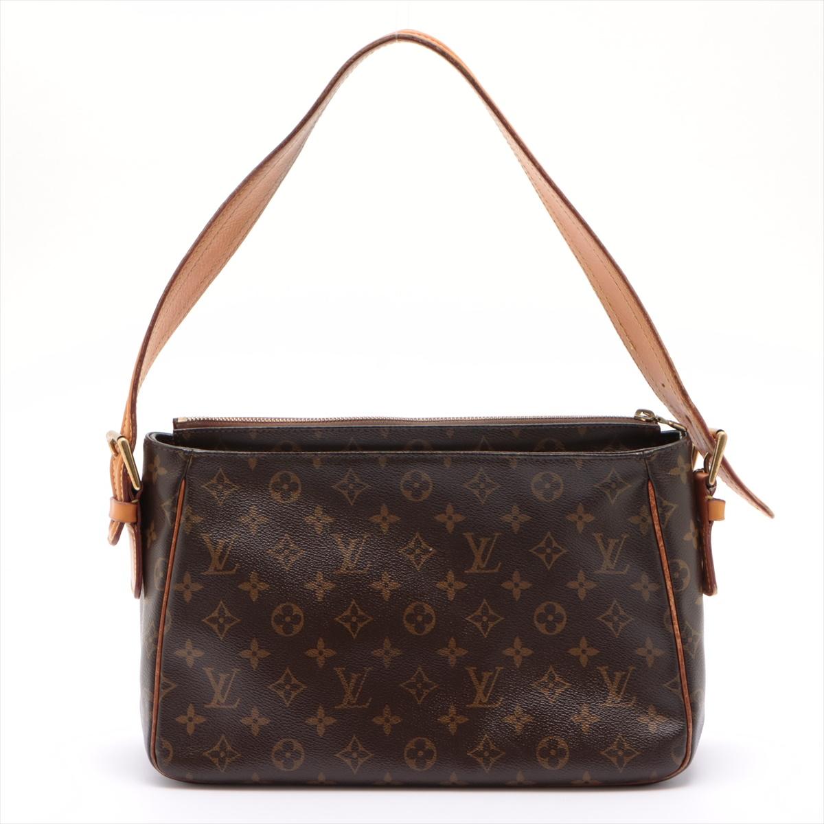 Brown and tan monogram coated canvas Louis Vuitton Viva Cite GM with gold-tone hardware, tan vachetta leather trim, flat shoulder strap, dual exterior pockets with snap closures, crimson Alcantara lining, dual slit pockets at interior walls and zip