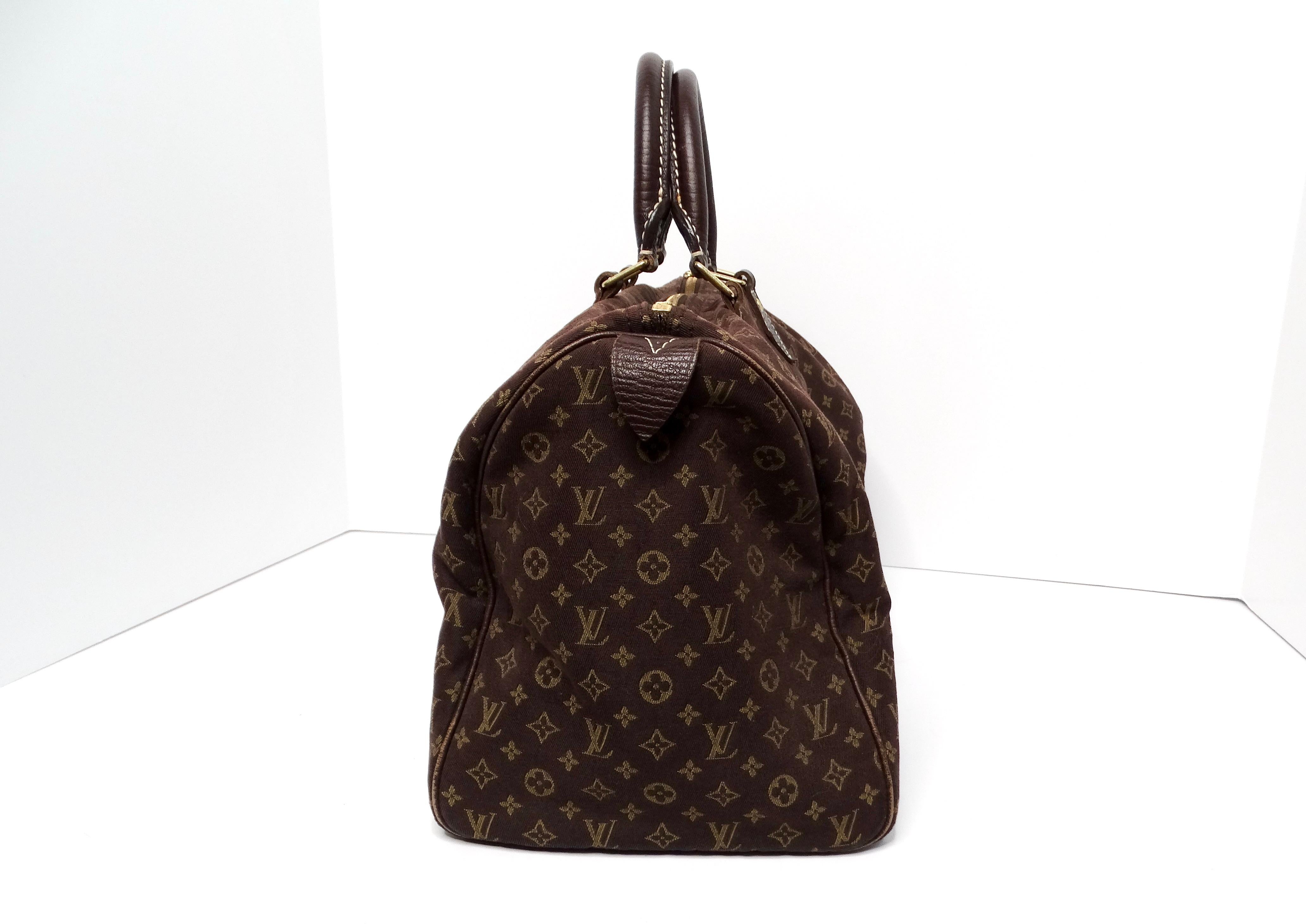 The Louis Vuitton Brown Monogram Canvas Mini Lin Speedy 30 is a quintessential piece that epitomizes luxury and sophistication. Crafted from premium canvas, this handbag features the iconic Louis Vuitton monogram in a timeless brown colorway,