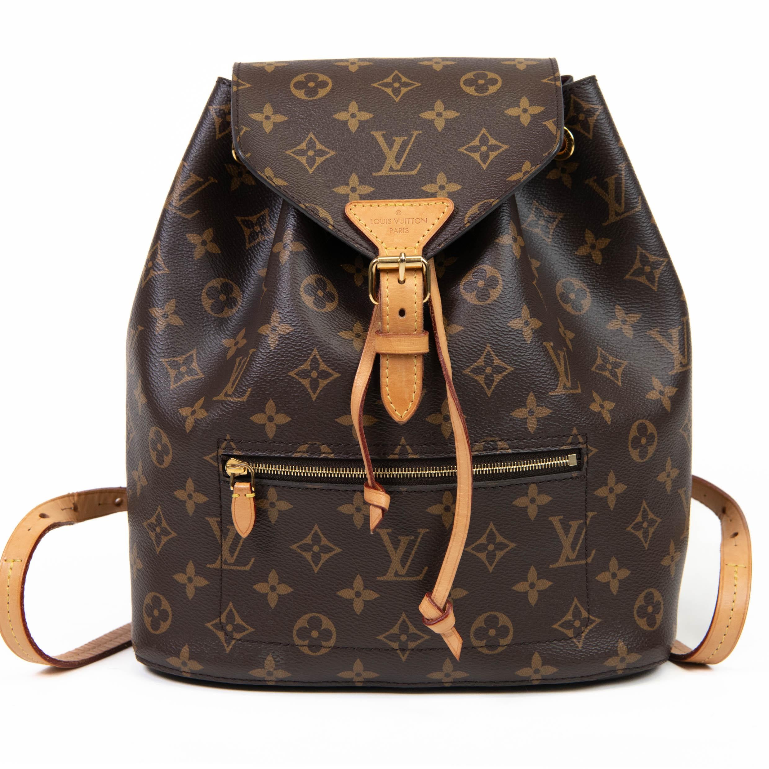100% Authentic

This stylish backpack is crafted of classic Louis Vuitton monogram on coated canvas in brown. It features a front zipper pocket, a vachetta leather trim, rolled vachetta handle, vachetta adjustable shoulder straps, and polished brass