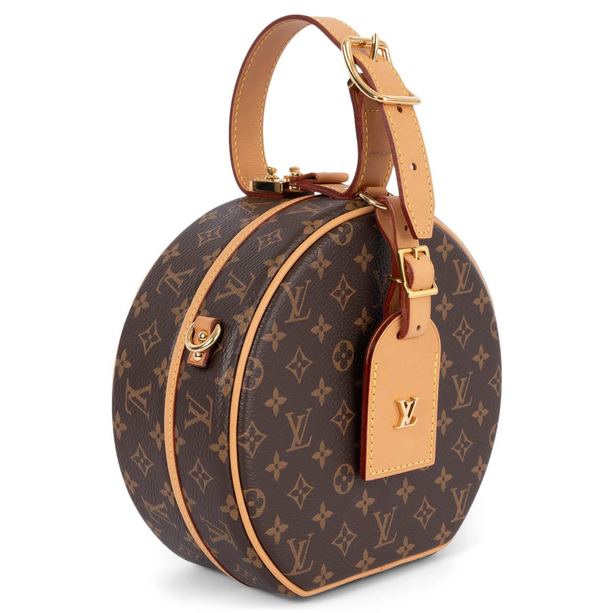 100% authentic Louis Vuitton Petite Boîte Chapeau iconic hatbox is reimagined as an adorable day-to-evening bag. Small yet practical, this exclusive piece comes in classic coated Monogram canvas with cowhide trim. Lined in cream lambskin with one