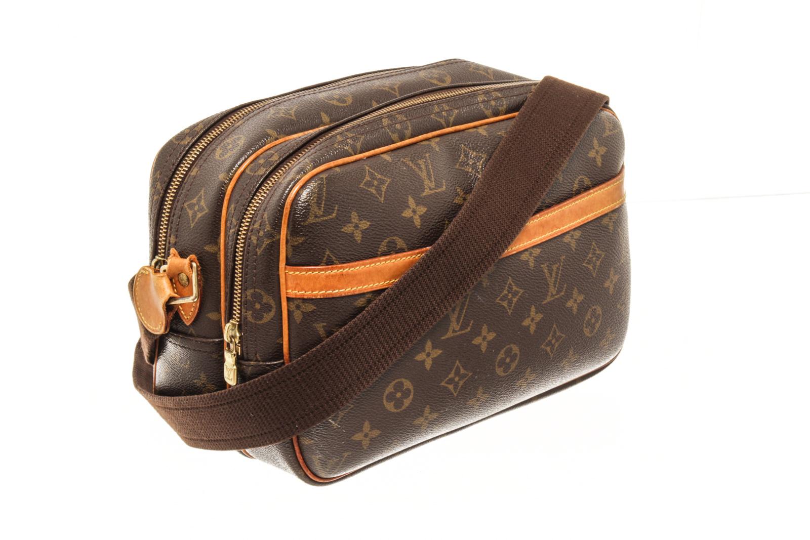 Louis Vuitton Brown Monogram Canvas Reporter PM Crossbody Bag with shoulder strap, exterior pocket, two zipper compartments, canvas lining, gold tone hardware, zipper closure. There are some stains on the canvas lining. 

86663MSC