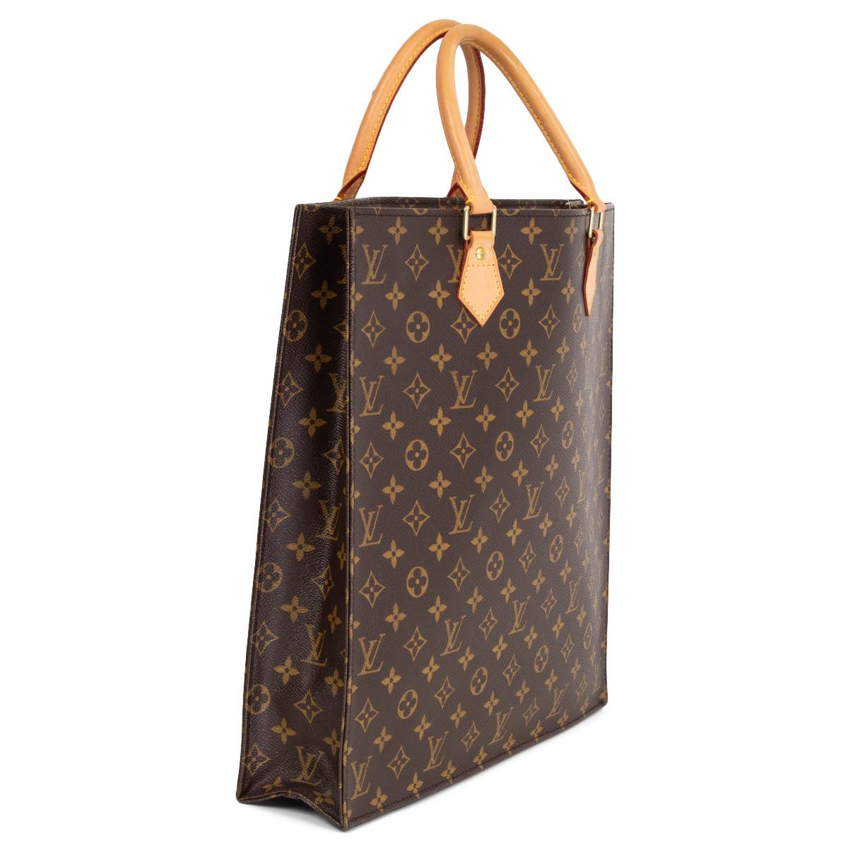 100% authentic Louis Vuitton Sac Plat GM in brown and olive Monogram Canvas with Vachetta cowhide leather handles. Lined in beige coated canvas with two patch pockets against the back. Has been carried once or twice and is in virtually new