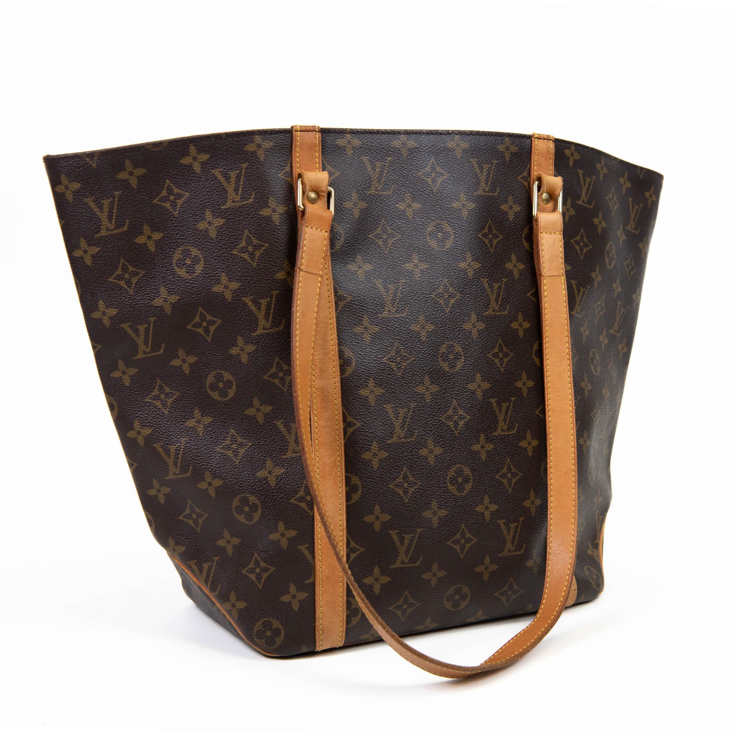 100% Authentic

This shopping tote is crafted of monogram coated canvas with vachetta trim and shoulder straps.The top is open to a cocoa brown fabric interior with a zipper pocket.

Base length: 10.00 in

Width: 5.50 in

Height: 13.00 in

Drop: