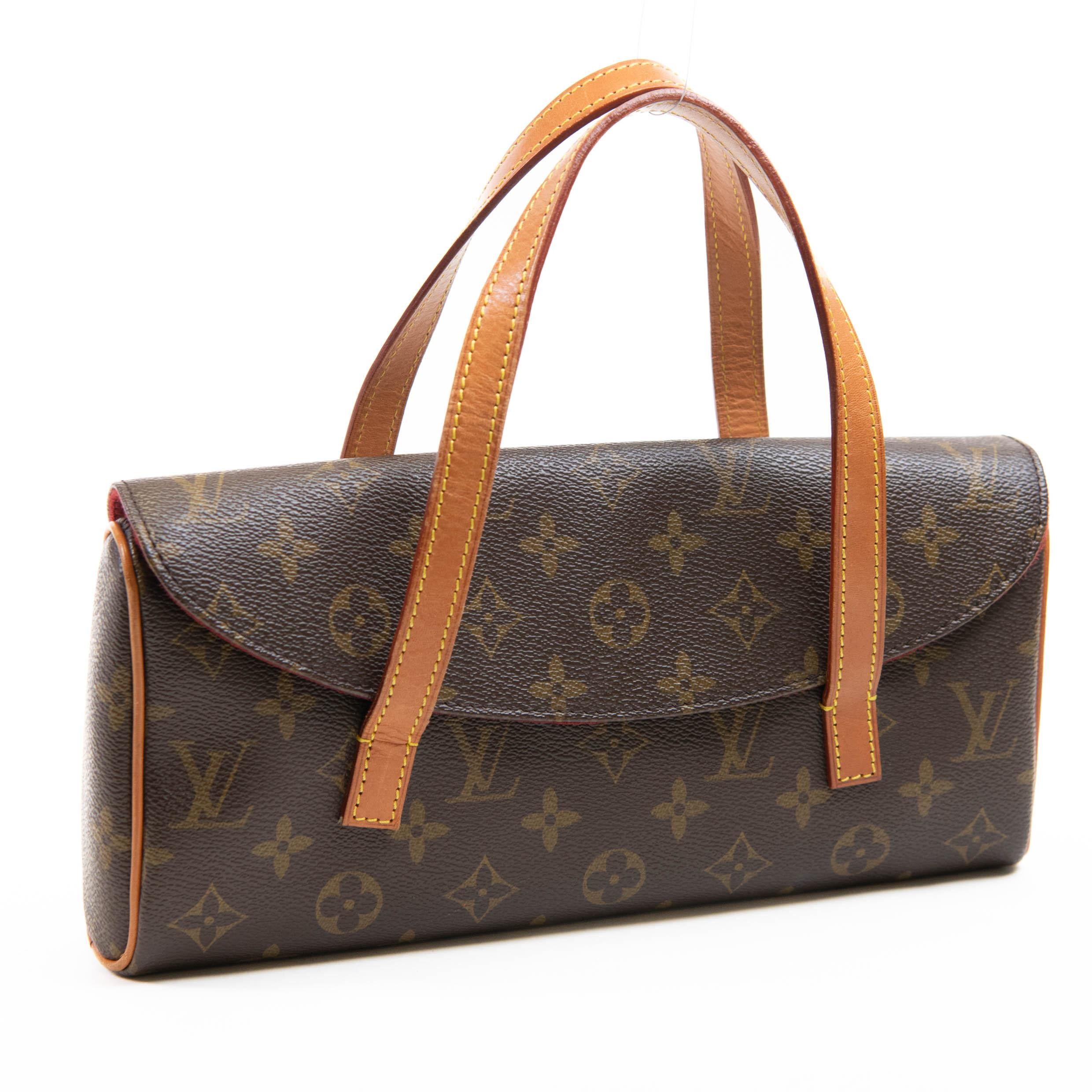 100% Authentic

This chic refined small handbag is crafted of monogram toile canvas and features vachetta leather strap & handles and piping trim. The front-facing flap opens to a rouge red microfiber interior with a patch pocket.

Base length: