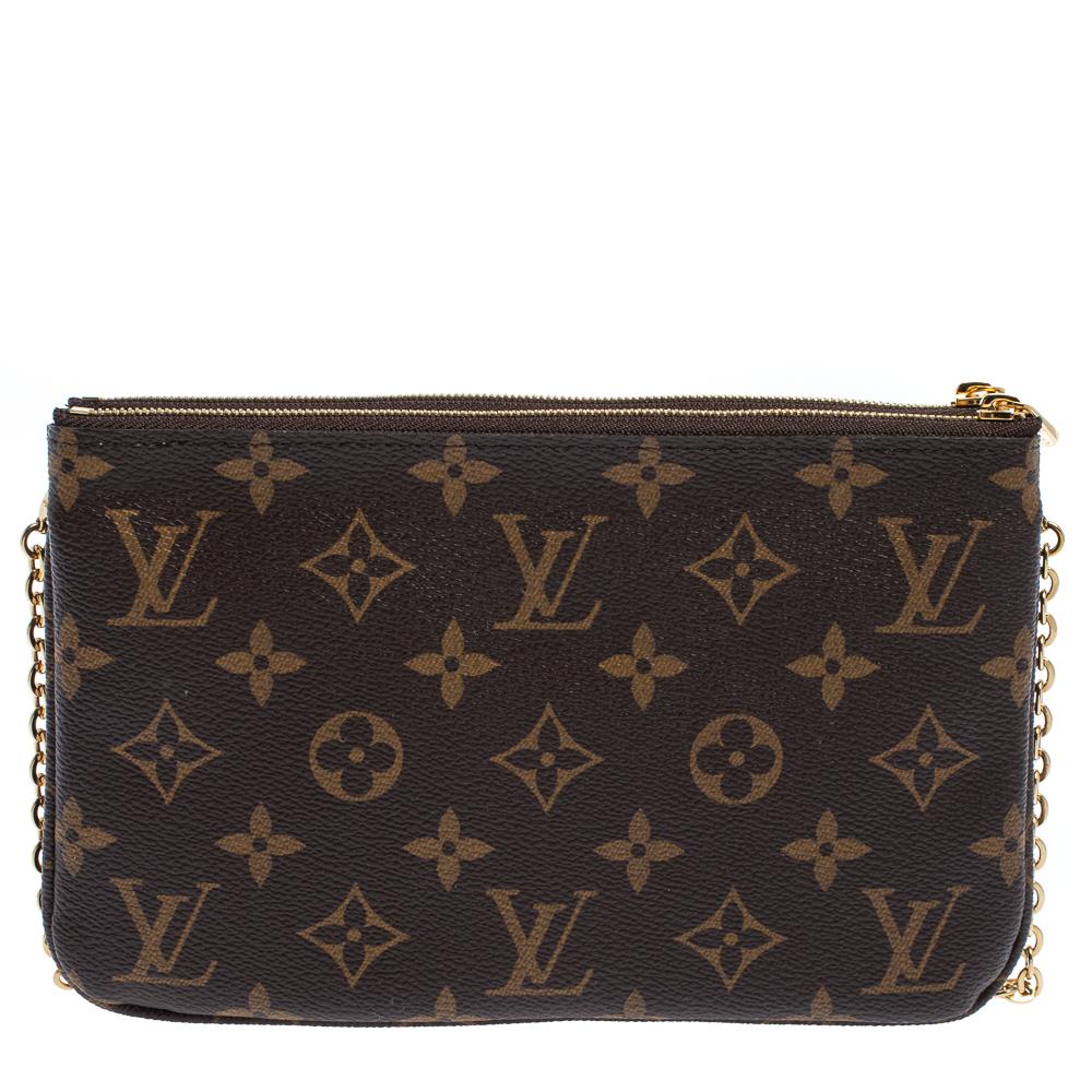 The exclusive Christmas Edition pochette from the house of Louis Vuitton is a stylish way to carry your basics. The pochette is crafted from the signature monogram canvas body and decorated with a pretty design on the front. The twin zipper
