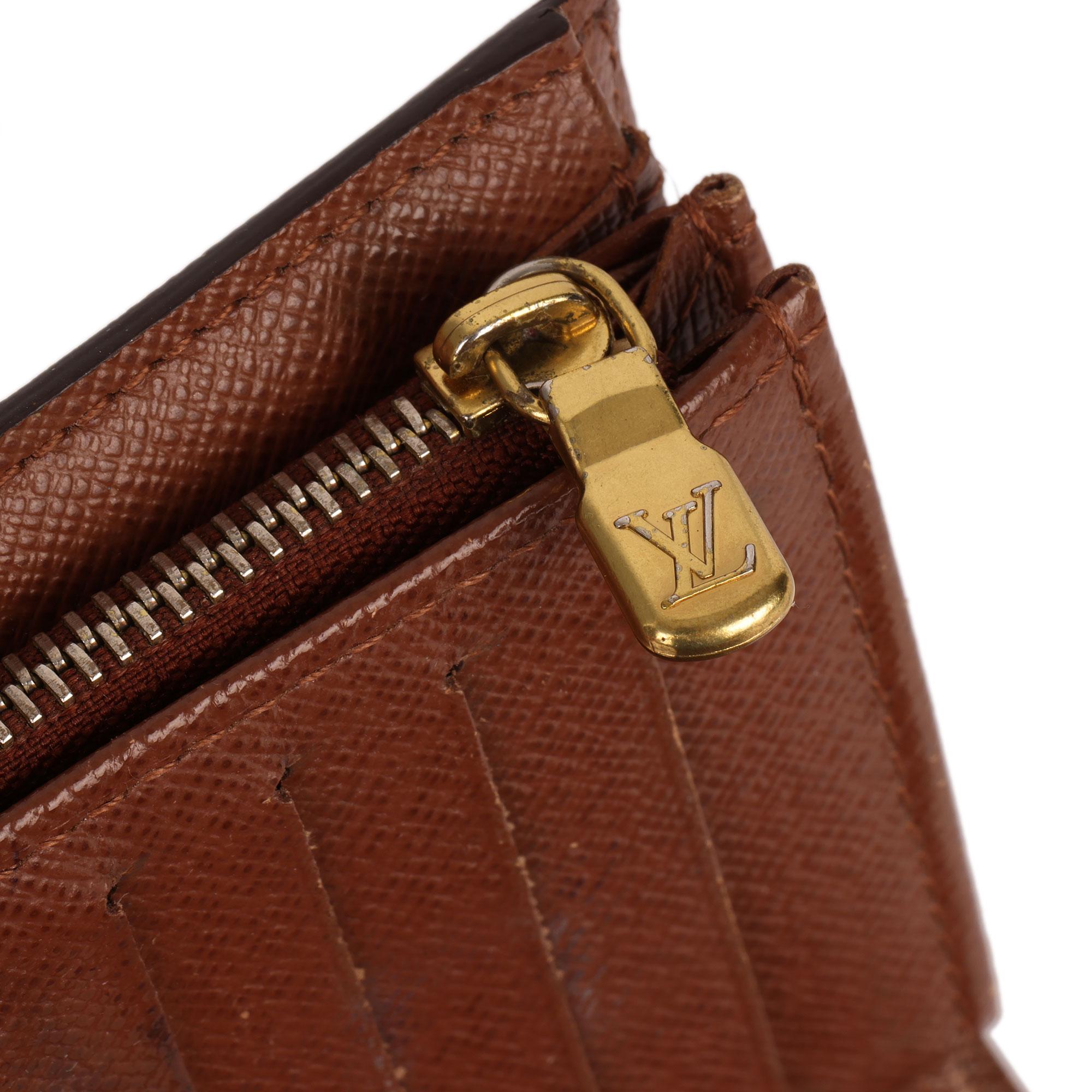 LOUIS VUITTON
Brown Monogram Coated Canvas Alexandra Wallet

Serial Number: CA2028
Age (Circa): 2008
Authenticity Details: Date Stamp (Made in Spain)
Gender: Ladies
Type: Accessory

Colour: Brown
Hardware: Golden Brass
Material(s): Coated