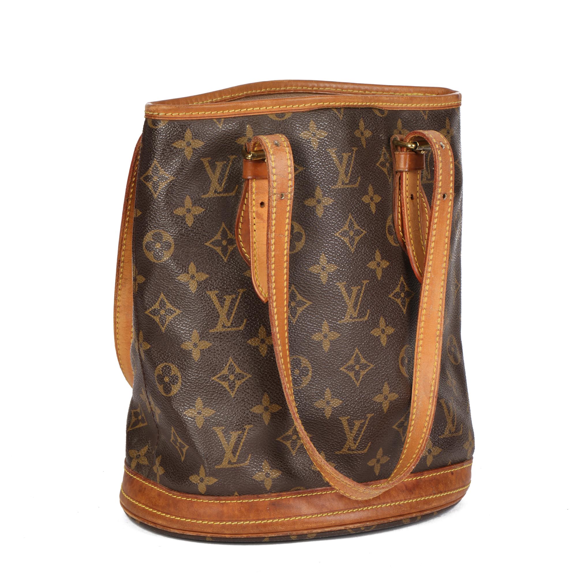LOUIS VUITTON
Brown Monogram Coated Canvas & Vachetta Leather Bucket Bag PM with Pouch

Xupes Reference: CB632
Serial Number: DK4087
Age (Circa): 2007
Accompanied By: Interior Pouch
Authenticity Details: Date Stamp (Made in France)
Gender: