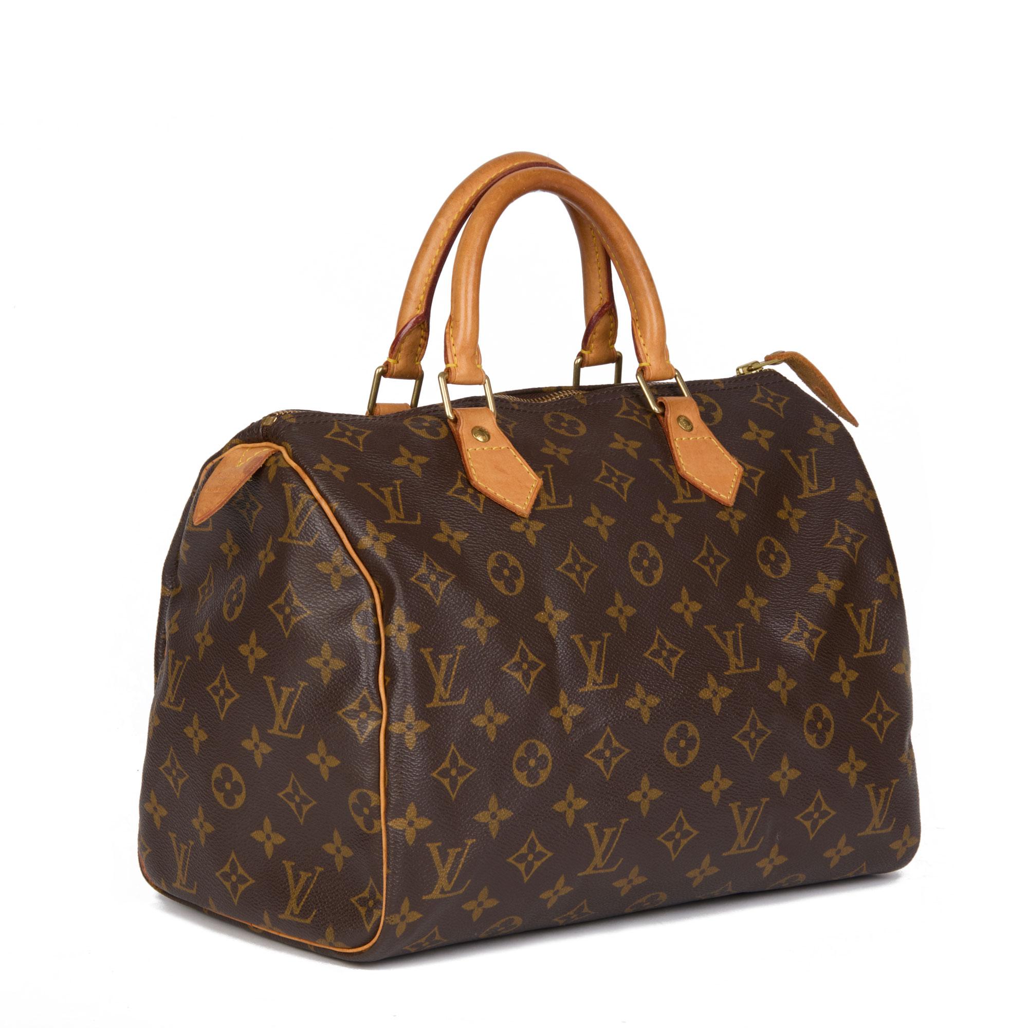 LOUIS VUITTON
Brown Monogram Coated Canvas & Vachetta Leather Speedy 30

Xupes Reference: HB4449
Serial Number: AA0044
Age (Circa): 2004
Authenticity Details: Date Stamp (Made in France)
Gender: Ladies
Type: Tote

Colour: Brown
Hardware: Golden