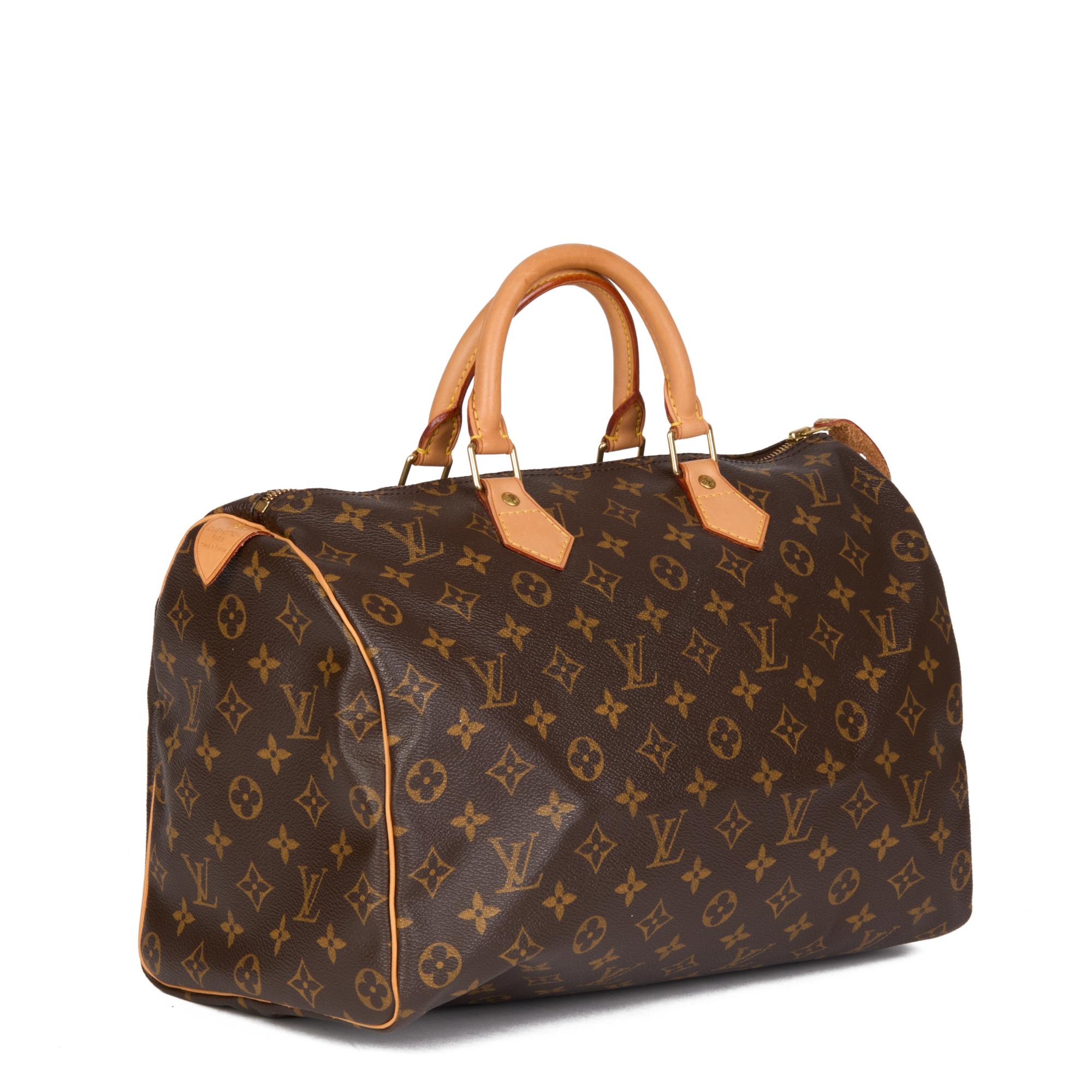 LOUIS VUITTON
Brown Monogram Coated Canvas & Vachetta Leather Speedy 35

Serial Number: TH1013
Age (Circa): 2003
Authenticity Details: Date Stamp (Made in France) 
Gender: Ladies
Type: Tote

Colour: Brown 
Hardware: Golden Brass
Material(s): Coated