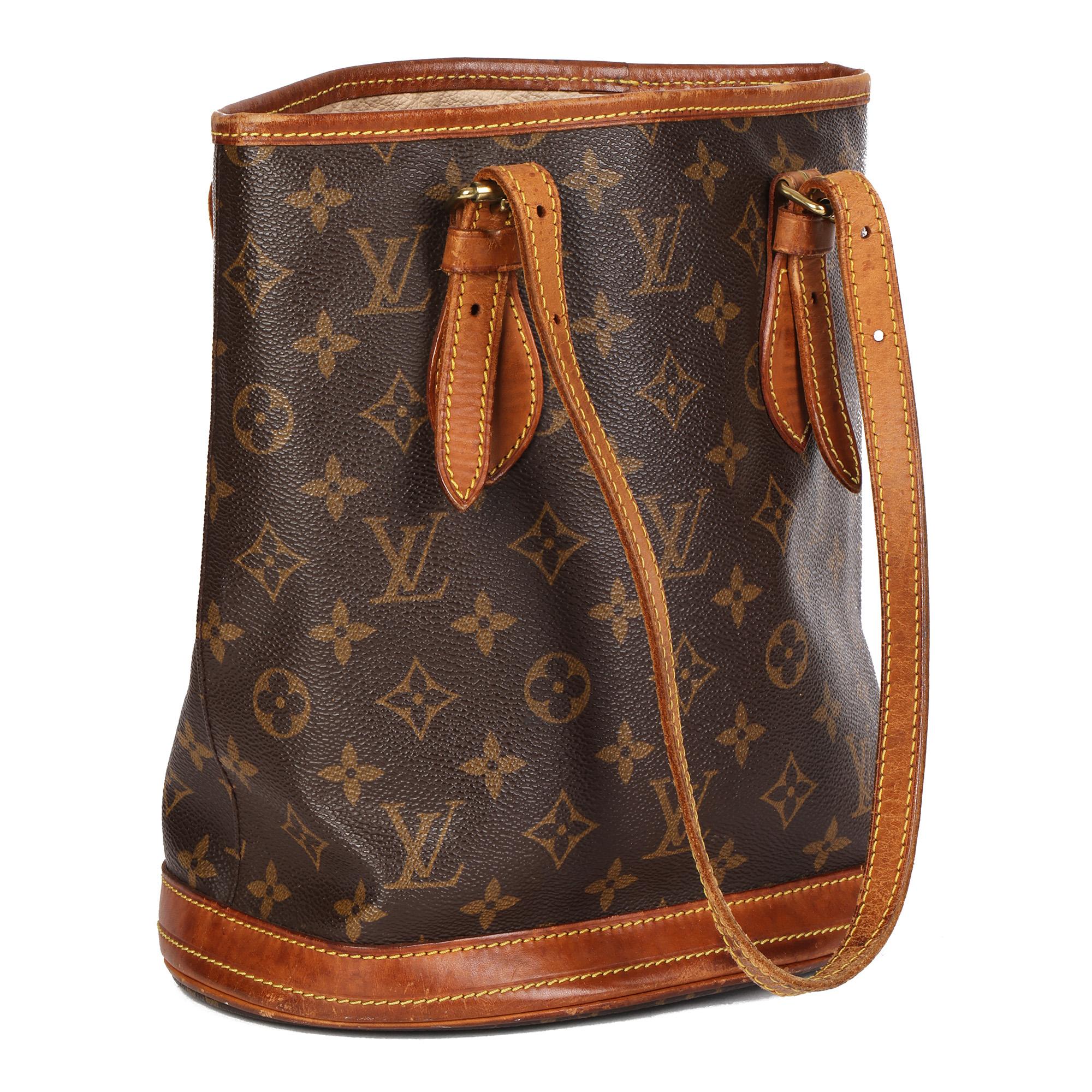 LOUIS VUITTON
Brown Monogram Coated Canvas & Vachetta Leather Vintage Bucket Bag PM with Pouch

Xupes Reference: CB653
Serial Number: AR0062
Age (Circa): 2002
Accompanied By: Louis Vuitton Dust Bag, Interior Pouch
Authenticity Details: Date Stamp
