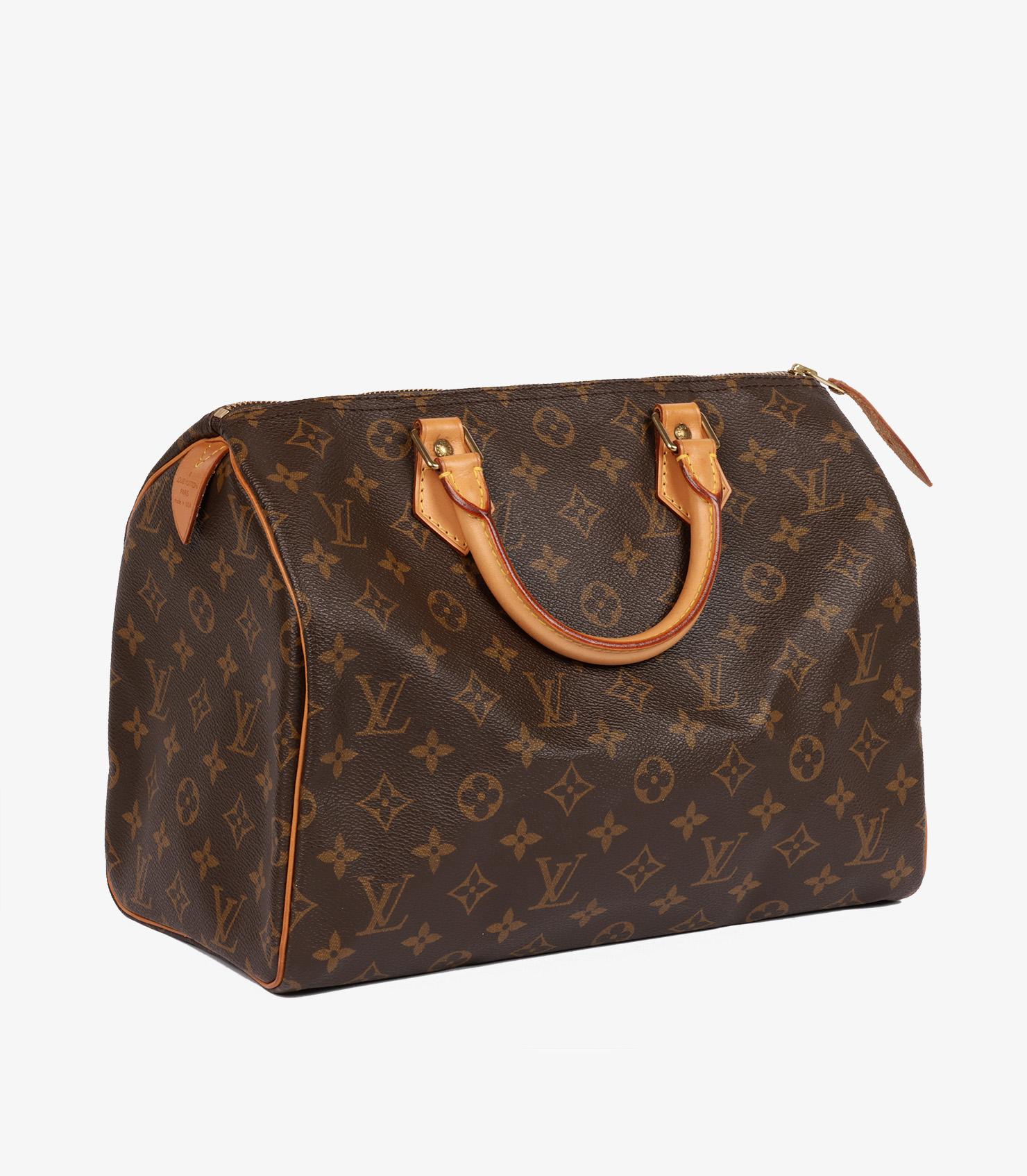 Louis Vuitton Brown Monogram Coated Canvas & Vachetta Leather Vintage Speedy 30

Product Details
Xupes Ref: HB5771
Brand: Louis Vuitton
Model: Speedy 30
Type: Tote
Serial Number: SD1904
Age: 2004
Accompanied By: Padlock, Key 
Colour: Brown
Hardware: