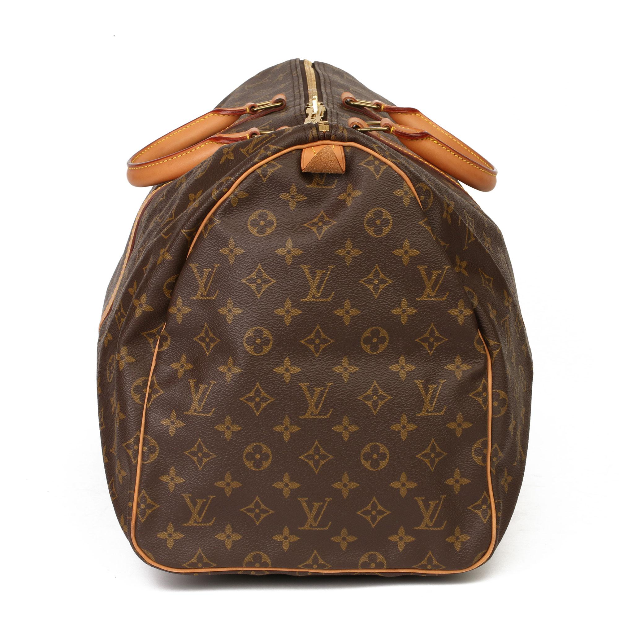 LOUIS VUITTON
Brown Monogram Coated Canvas & Vachetta Leather Vintage Keepall 55

Xupes Reference: HB3703
Serial Number: MI0972
Age (Circa): 1992
Authenticity Details: Date Stamp (Made in France) 
Gender: Unisex
Type: Travel

Colour: Brown
Hardware: