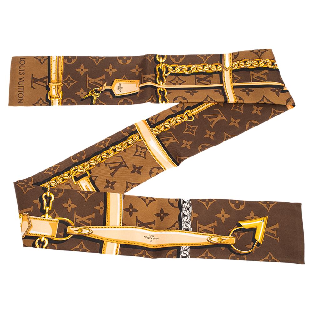 A perfect gift, this silk bandeau is printed with the iconic Louis Vuitton details - leather straps, metal chains, and padlocks - on a background of the brand's famous Monogram pattern. This stylish accessory can be worn in many different ways and