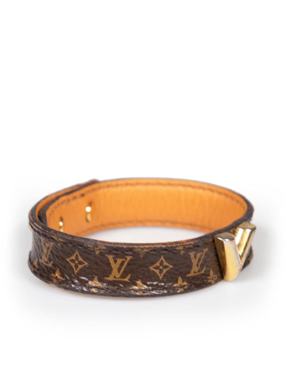 CONDITION is Very good. Minimal wear to bracelet is evident. Minimal wear with general creasing and abrasions to edge and inside leather. There is some slight tarnishing to the metal logo on this used Louis Vuitton designer resale item.
 
 
 
