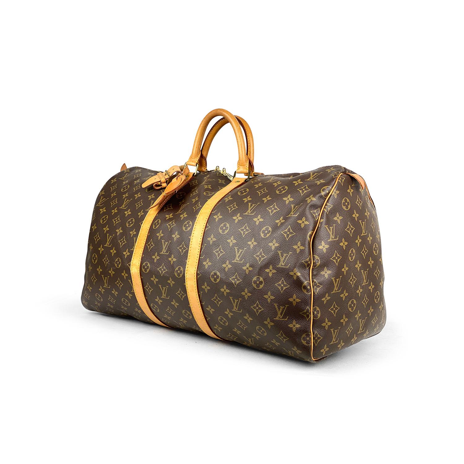 Brown and tan monogram coated canvas Louis Vuitton Keepall 55 with

- Brass hardware
- Tan vachetta leather trim
- Dual rolled top handles
- Tonal canvas lining and two-way zip closure at top

Overall Preloved Condition: Good
Exterior Condition: