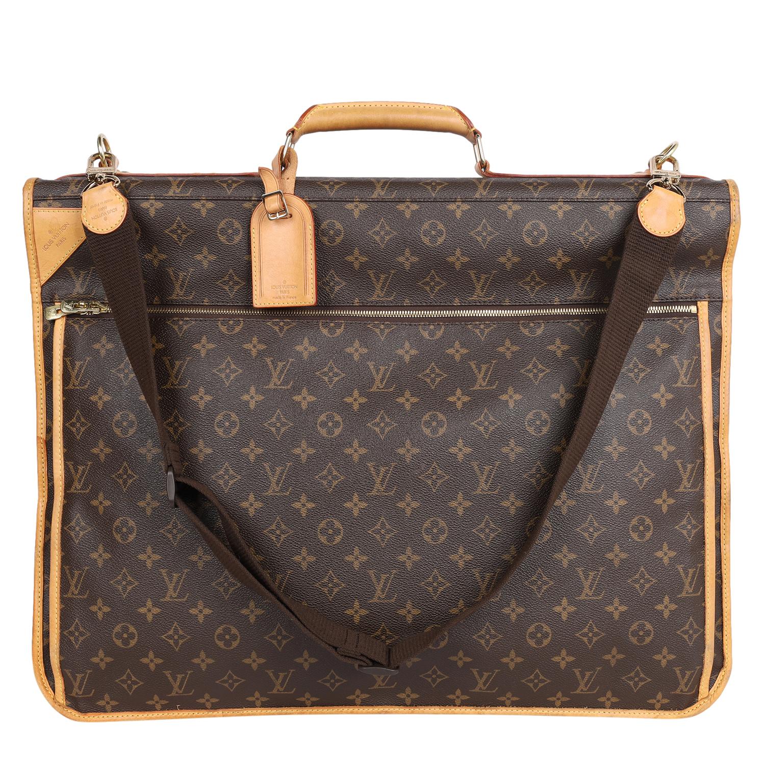 Authentic, pre-loved Louis Vuitton brown monogram portable garment bag suitcase. Features monogram canvas, a zip-around closure with monogrammed zippers, gold-toned hardware, a removable/adjustable shoulder strap, leather handle, and a removable