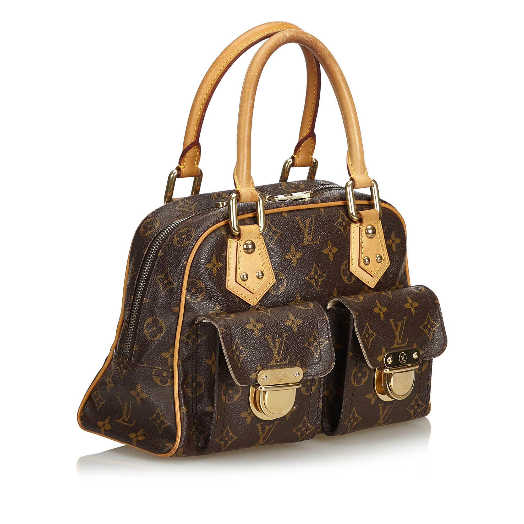 The Manhattan GM features a monogram canvas body, rolled leather handles, exterior flap pockets with gold-tone hardware and push lock closures, a top zip closure, and an interior slip pocket. It carries as B condition rating.

Inclusions: 
This item