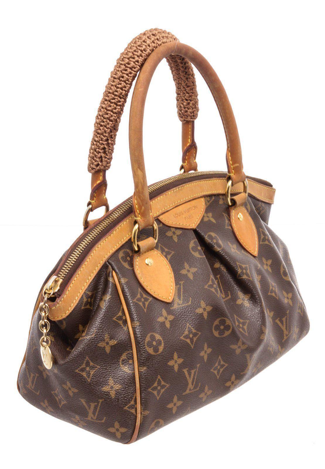Louis Vuitton Brown Monogram Tivoli PM Satchel Bag with gold-tone hardware, leather trim, rolled handles, canvas lining & dual interior pockets, zip closure.

30355MSC
MEASUREMENTS:
 Length 4.5 in / 11 cm
 Width 13 in / 33 cm
 Height 8.75 in / 22