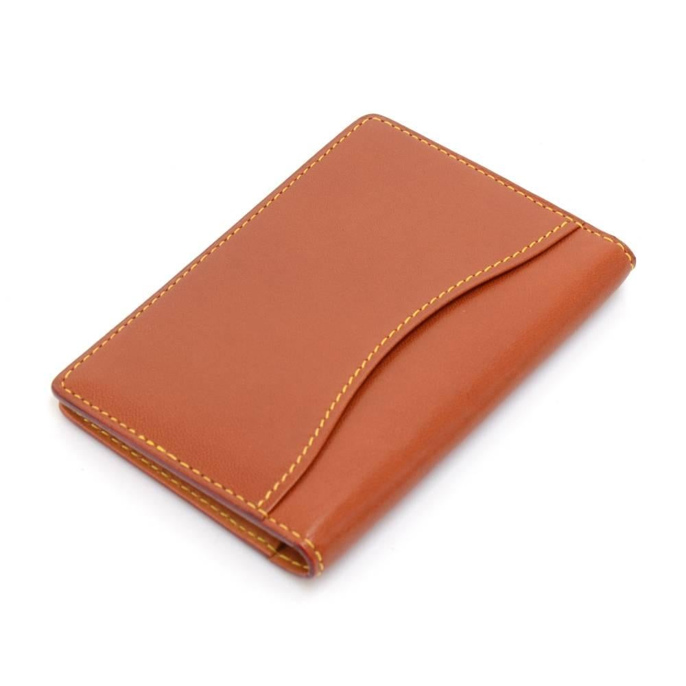 Louis Vuitton Brown nomade leather card case with  7 slip pockets. Great to keep your cards / passes organized.  SKU: LO643

Made in: France
Serial Number: SN0076
Size: 4.3 x 3 x 0 inches or 11 x 7.5 x 0 cm
Color: Brown
Dust bag:   Yes included 