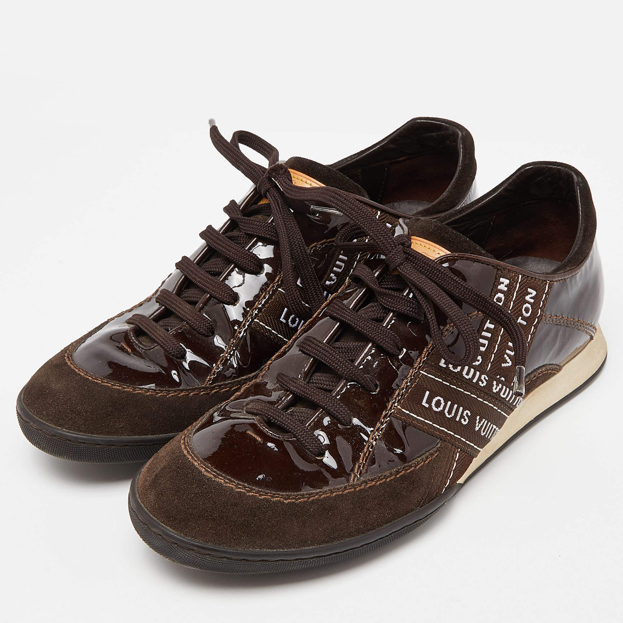 Coming in a classic low top silhouette these Louis Vuitton sneakers are a seamless combination of luxury comfort and style. They are made from patent leather and suede in a brown shade. These sneakers are designed with logo prints laced up vamps and
