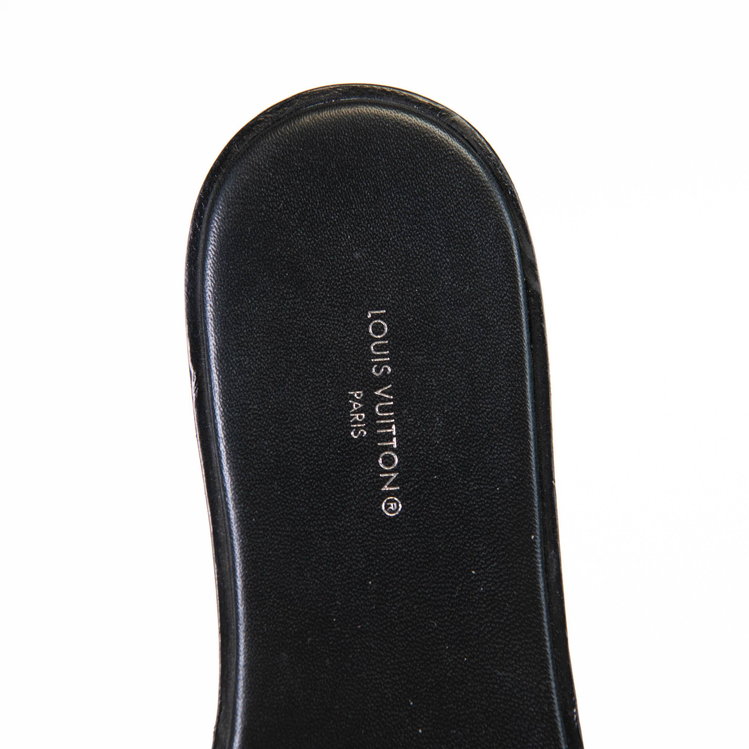 100% Authentic 

These chic slides are crafted of Louis Vuitton monogram coated canvas with a signature Louis Vuitton logo in gold. These stylish sandals feature black leather insoles.

Very Good Condition- Wear to Soles

Comes with