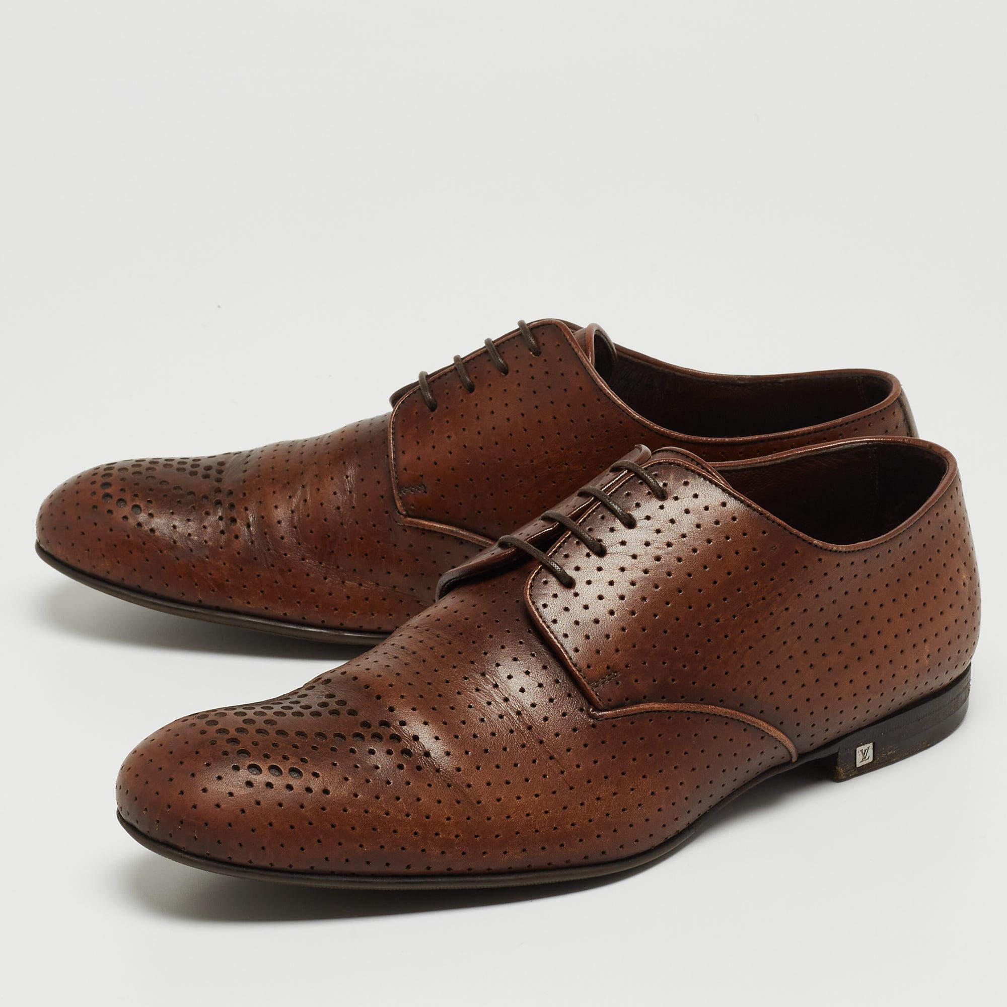 These Louis Vuitton derby shoes aim to deliver a fashionable result. Constructed using brown perforated leather and secured with laces, these shoes are as durable as they are appealing.

