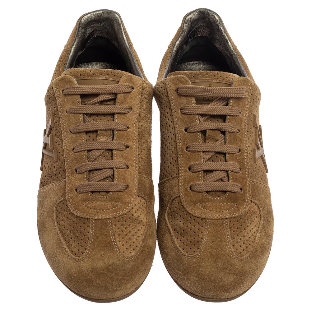 These brown sneakers from Louis Vuitton are just what you need to add to your style. They are crafted from perforated suede and feature round toes, lace-ups on the vamps, and LV logo detailing on the sides. They offer a comfortable fit with their