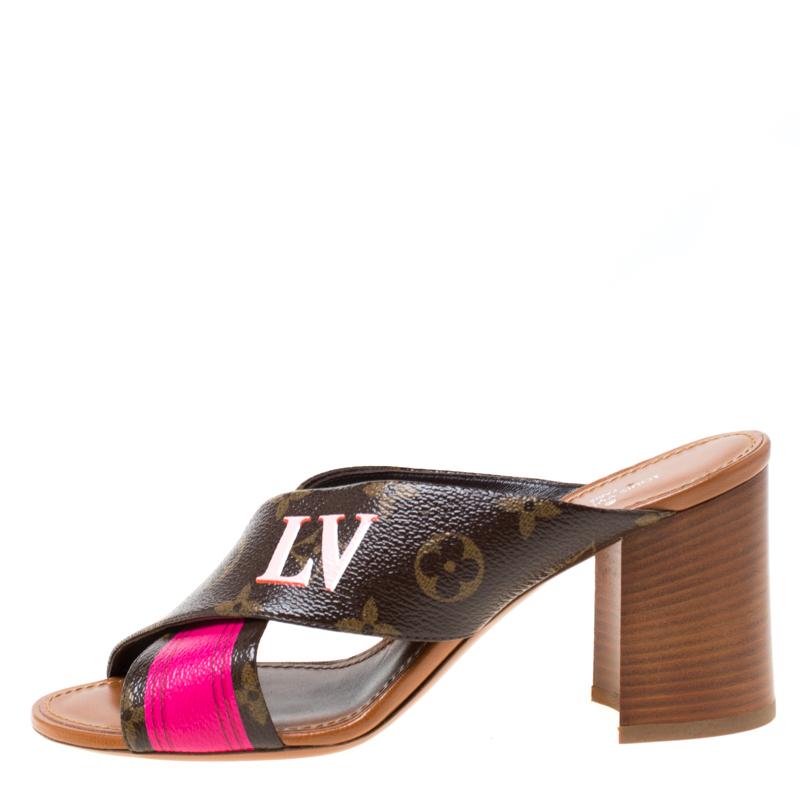 You'll love flaunting these gorgeous sandals from Louis Vuitton that are sure to grab you a lot of compliments. These Panorama mules are crafted from monogram coated canvas and are accented with a pink-colored trim and feature an open toe