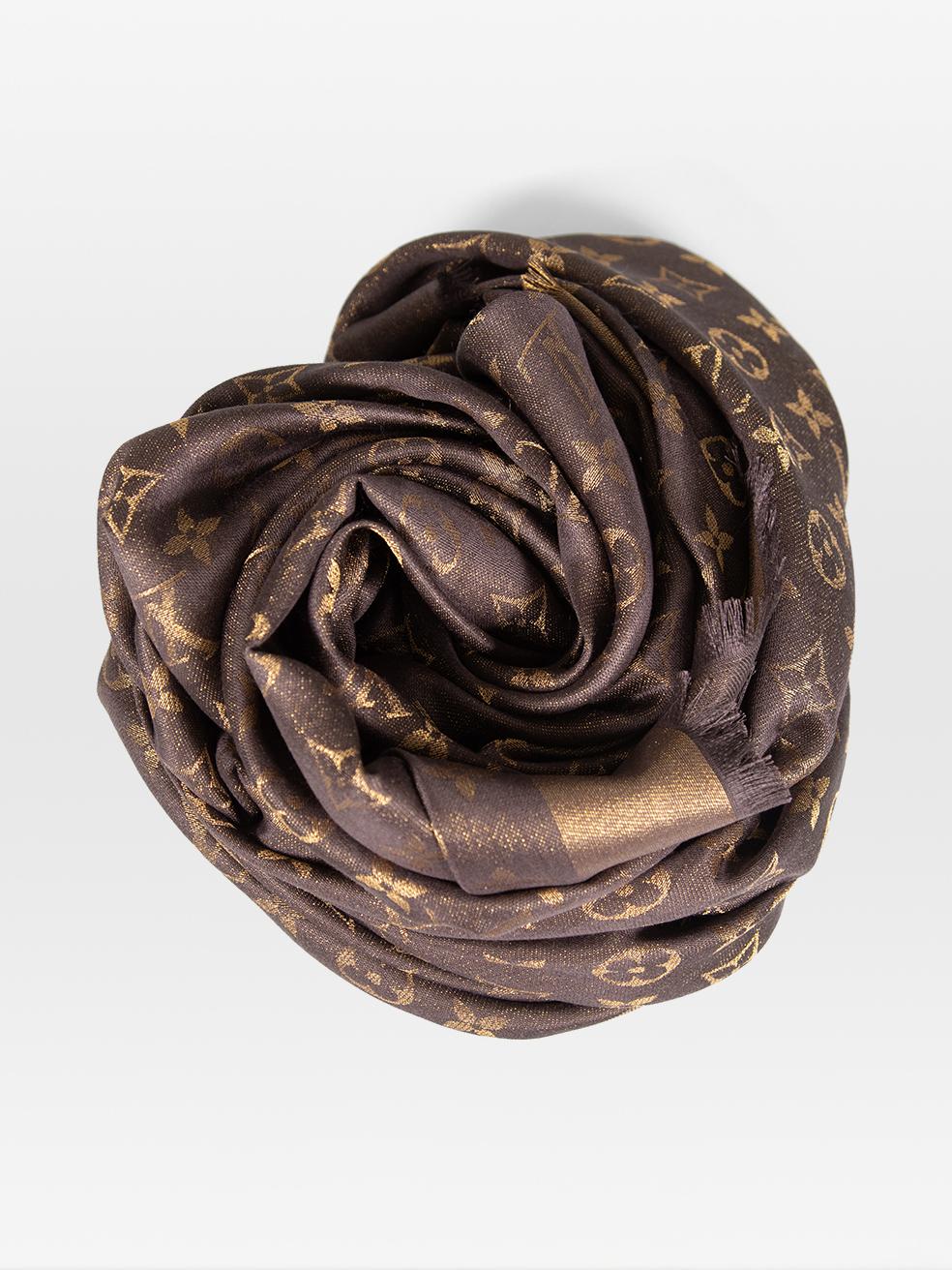 CONDITION is Very Good. Hardly any visible wear to the scarf is evident on this used Louis Vuitton designer resale item.
 
 
 
 Details
 
 
 Brown
 
 Silk
 
 Square shawl
 
 Monogram jacquard pattern
 
 Fringed edges
 
 
 

 
 Made in Italy
 

 
