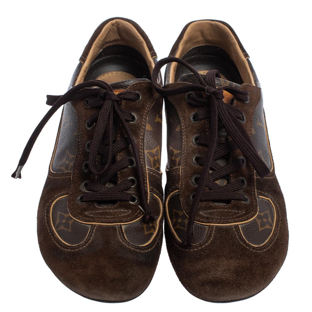 These Energie sneakers from Louis Vuitton are all you need for a fun outing with friends! The brown sneakers have been crafted from suede and monogram canvas and feature round toes and lace-ups on the vamps. They flaunt the brand's signature on the
