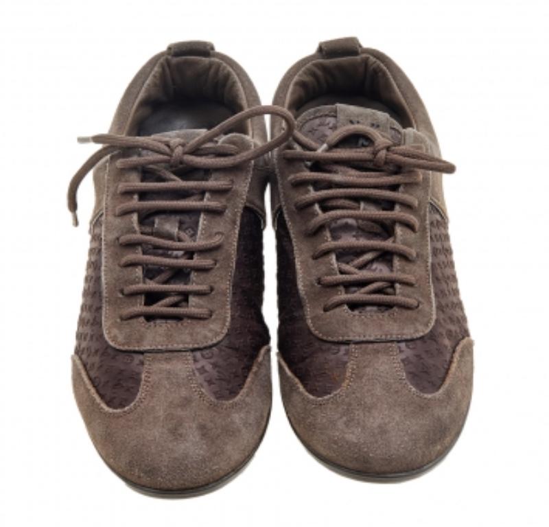 A pair that will see you through a long day in full comfort! Crafted using suede and monogram satin, these Louis Vuitton sneakers are designed in a low-top style, secured with lace-ups, and set atop durable rubber soles.