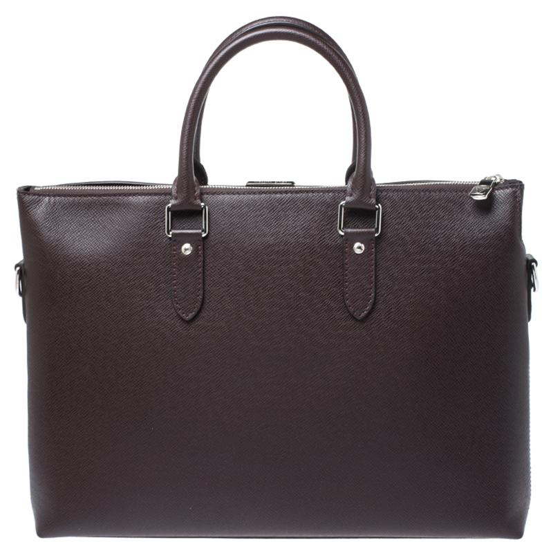 A practical bag for work and meetings this Louis Vuitton number will be your best companion. This Anton Soft briefcase is crafted from Taiga leather and secured with zip closure. It comes fitted with two rolled top handles and silver-tone hardware.