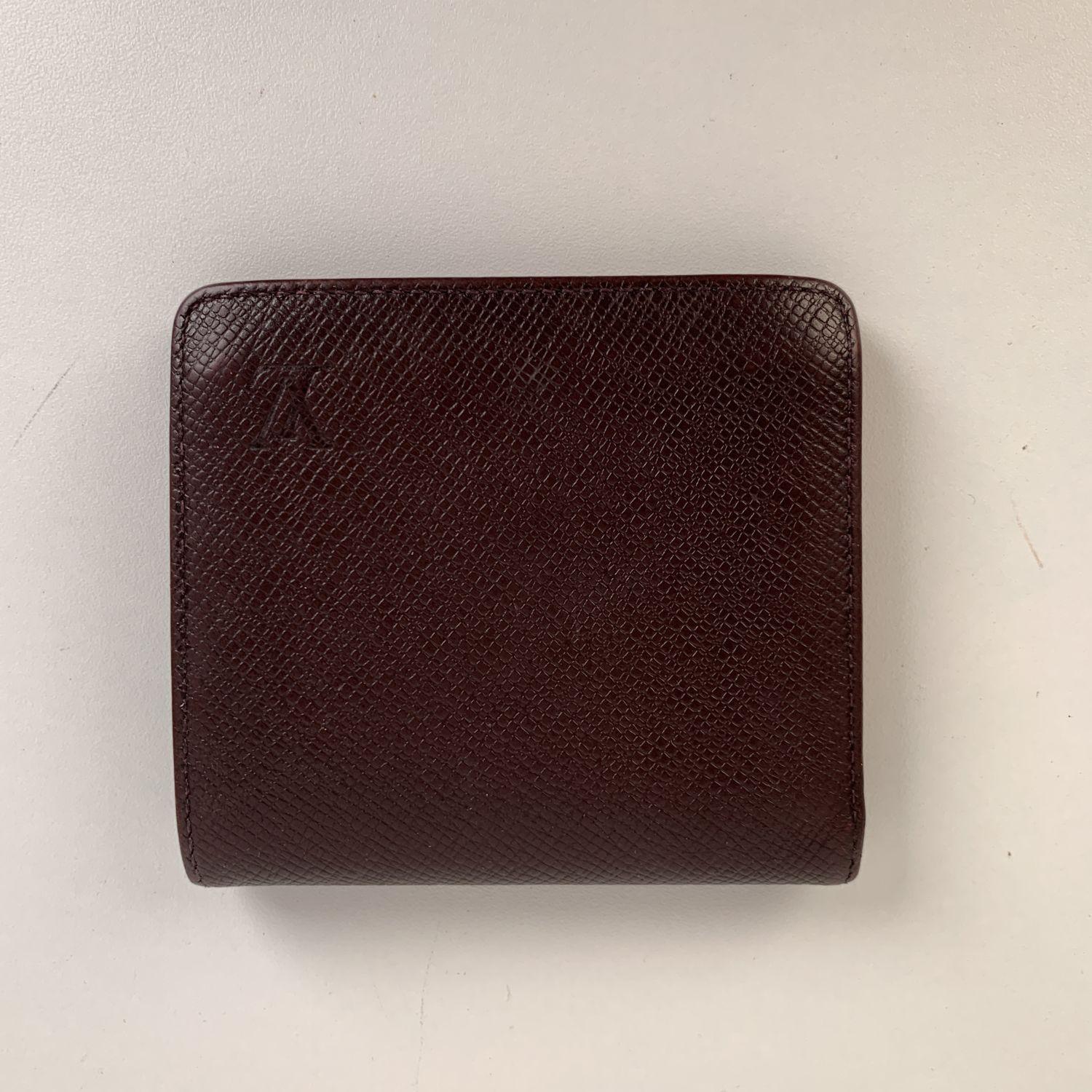 Louis Vuitton brown taiga leather 'Porte Billets 3 Cartes' bifold wallet. LV - LOUIS VUITTON monogram engraved on leather on the front. LOUIS VUITTON Paris - made in France' embossed inside. 3 credit card slots, 1 bill compartment , 1 coin