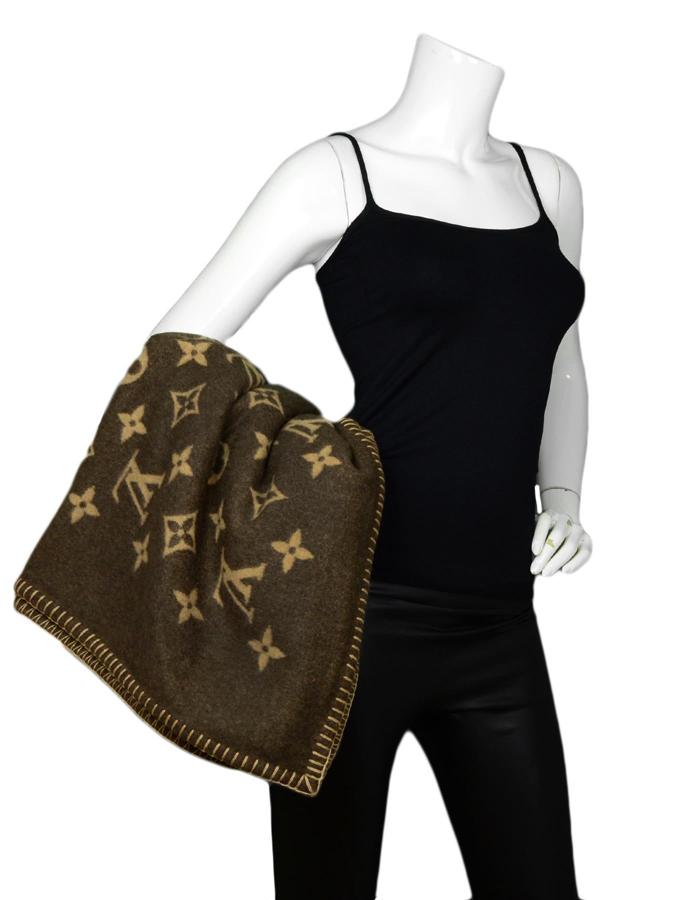 Louis Vuitton Brown Wool & Cashmere Neo Monogram Throw Blanket

Made In: United Kingdom
Color: Brown, Tan
Materials: 90% Wool, 10% Cashmere
Overall Condition: Excellent pre-owned condition
Estimated Retail: $1,420

Measurements: 
54