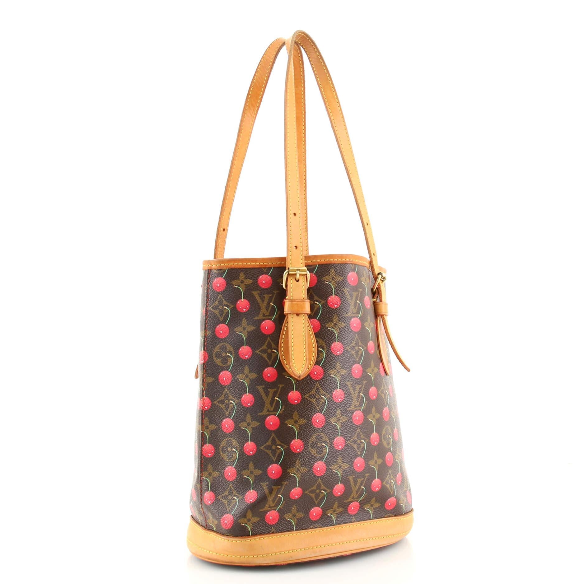 Condition: Fair. Creasing and wear on exterior, heavy darkening, wear, scuffs and watermarks on leather trims and handles, peeling on handle wax edges. Wear, stains and moderate pen marks in interior, scratches and tarnish on hardware.
Accessories: