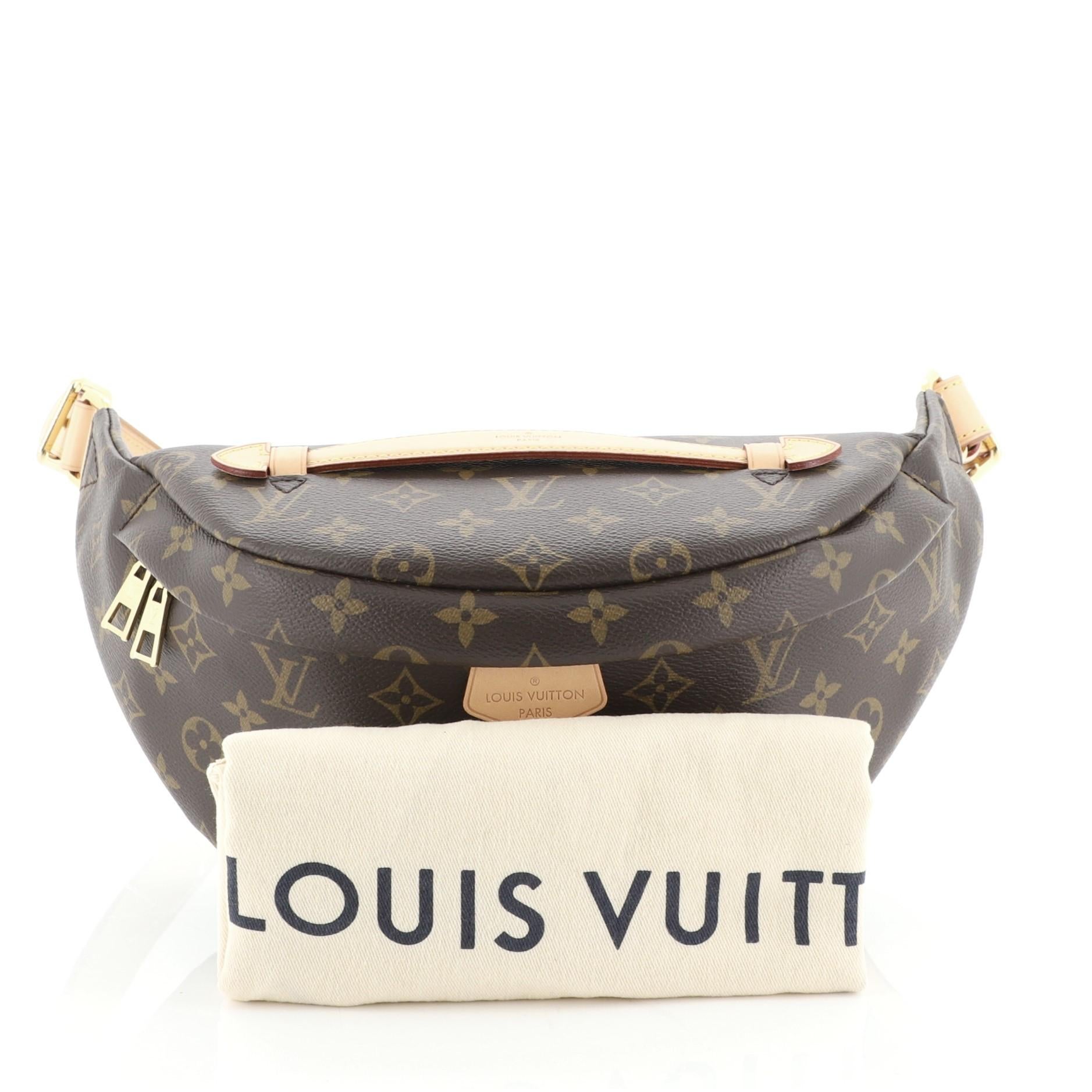 This Louis Vuitton Bum Bag Monogram Canvas, crafted from brown monogram coated canvas, features an adjustable strap, leather top handle, exterior back zip pocket, and gold-tone hardware. Its zip closure opens to a black fabric interior with slip