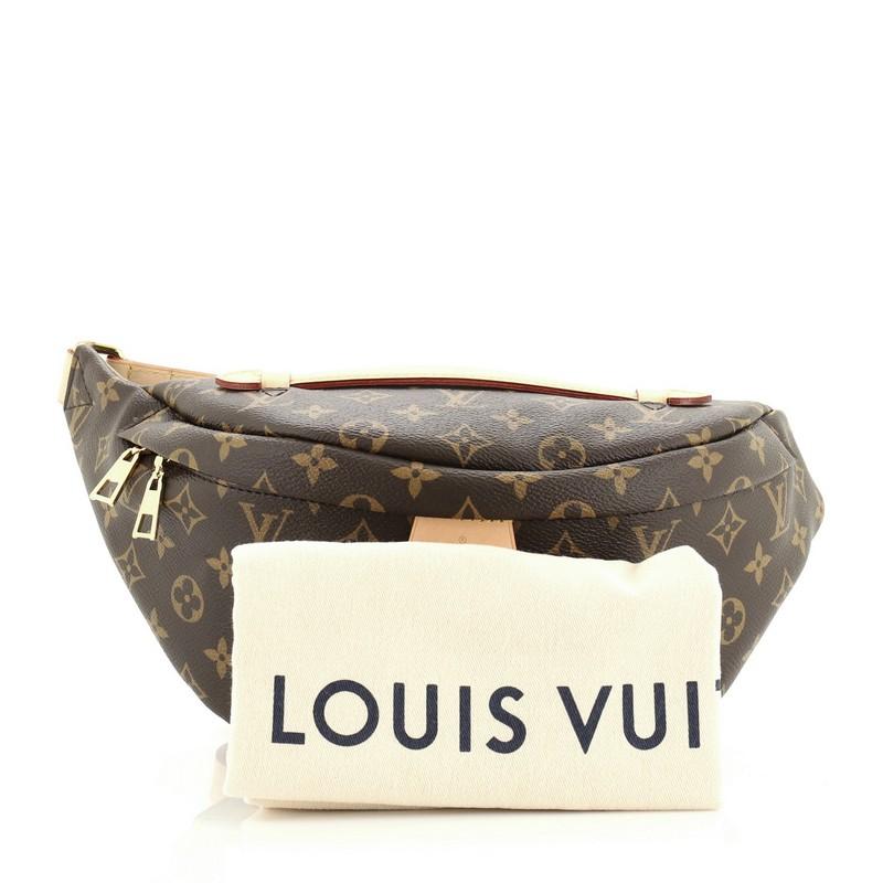 This Louis Vuitton Bum Bag Monogram Canvas, crafted from brown monogram coated canvas, features an adjustable strap, leather top handle, exterior back zip pocket, and gold-tone hardware. Its zip closure opens to a black fabric interior with slip