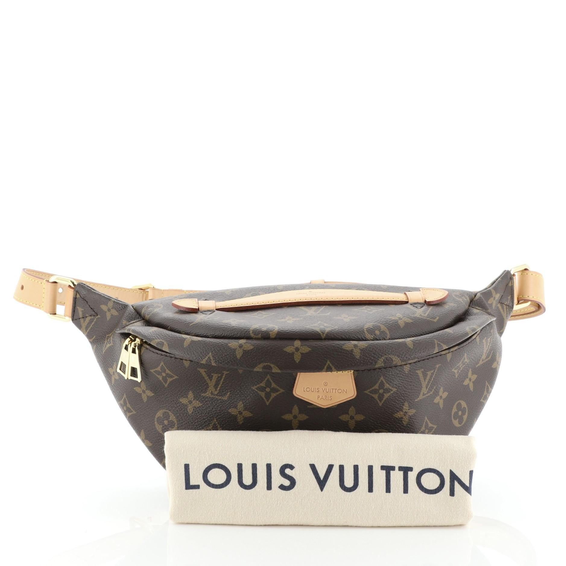 This Louis Vuitton Bum Bag Monogram Canvas, crafted from brown monogram coated canvas, features an adjustable strap, leather top handle, exterior back zip pocket, and gold-tone hardware. Its zip closure opens to a black fabric interior with slip