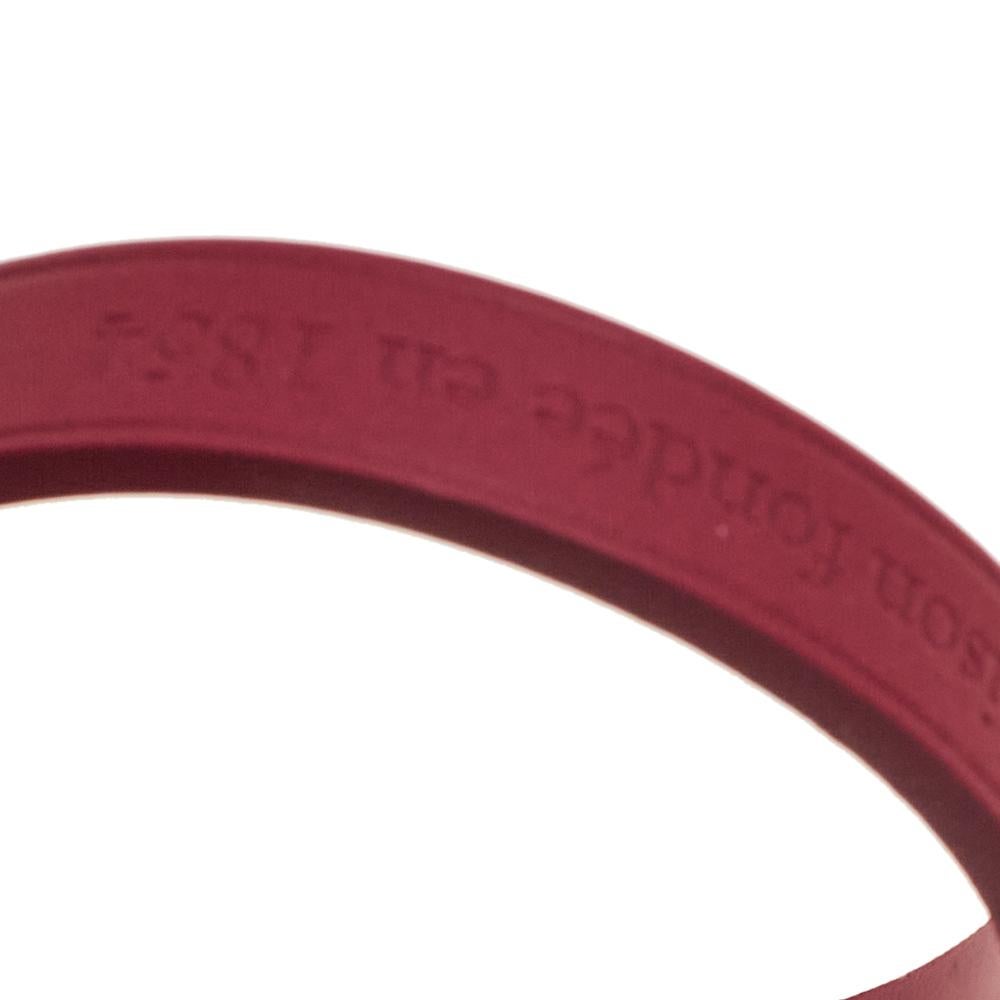 A wrap bracelet by Louis Vuitton made from leather and detailed with a gold-tone buckle fastening. It has statement details and a comfortable fit. The burgundy-hued creation can be stacked with your watches and other bracelets too.

Includes: